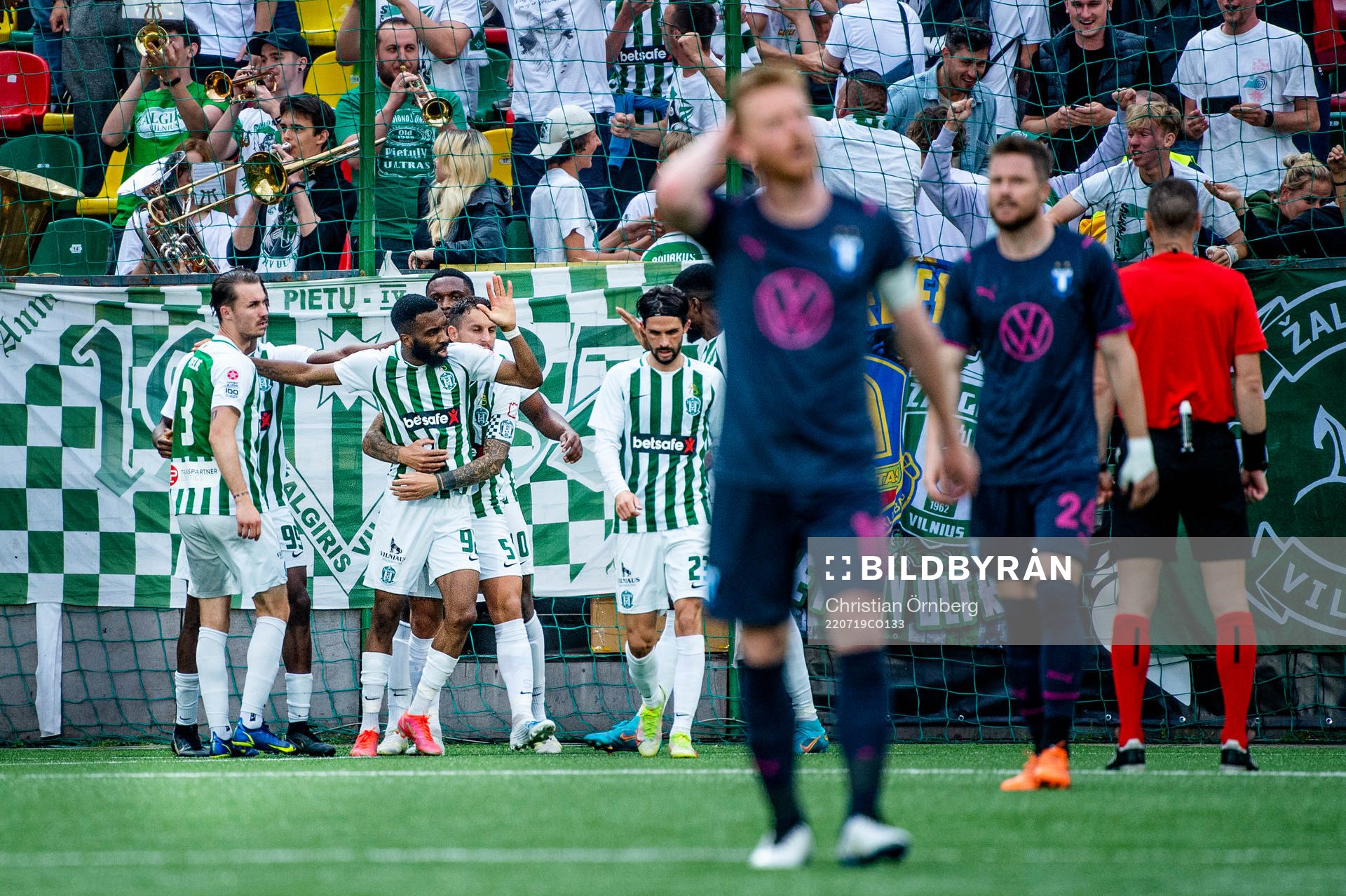 Fabien Ourega and the supporters of FK Zalgiris celebrate