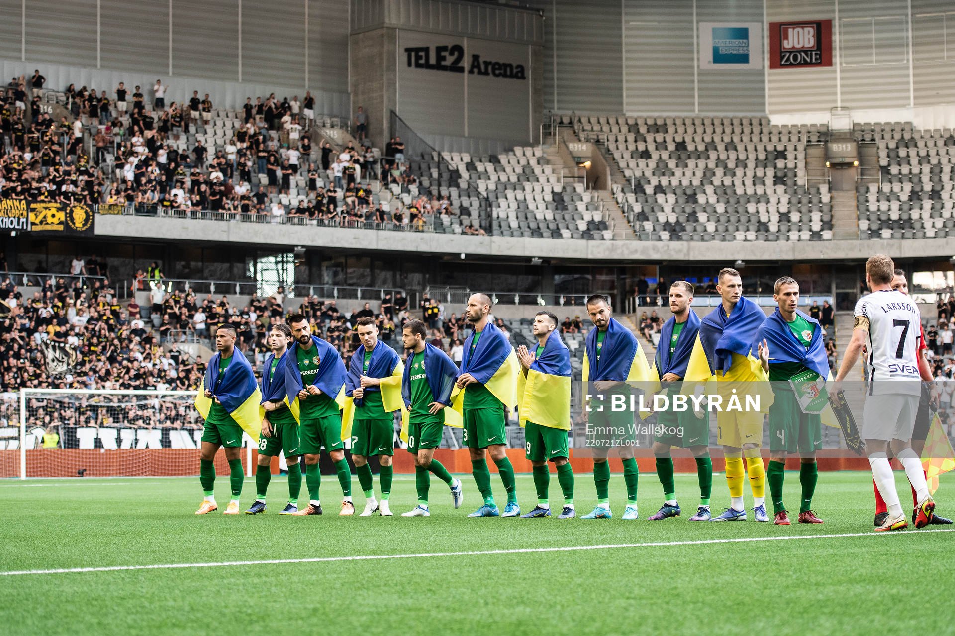 Players of Vorskla Poltava with flags of Ukraine ahead of the UEFA Europa Conference League qualifying match between Vorskla Poltava and AIK on July 21, 2022 in Stockholm.