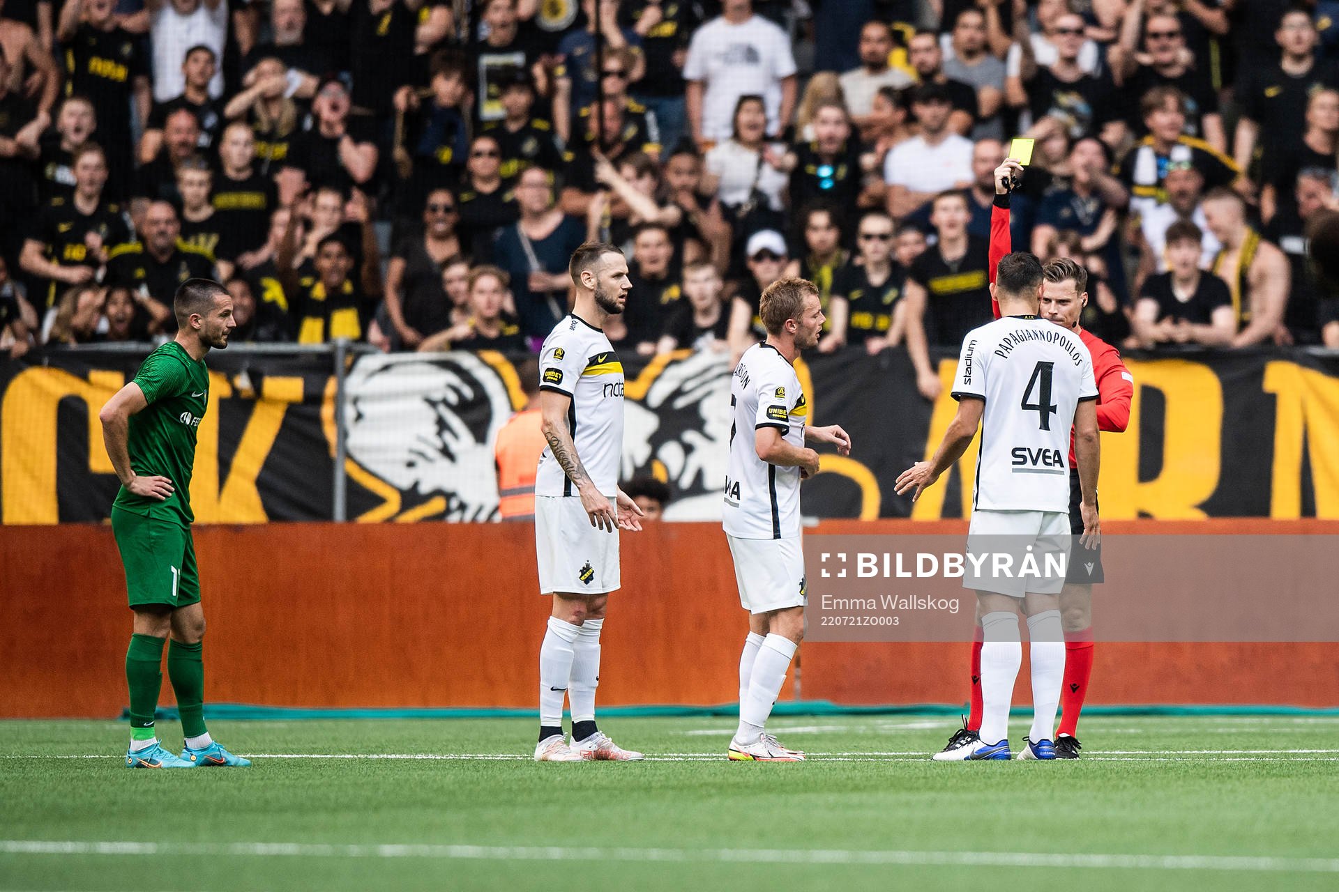 Sebastian Larsson of AIK recieves a yellow card from