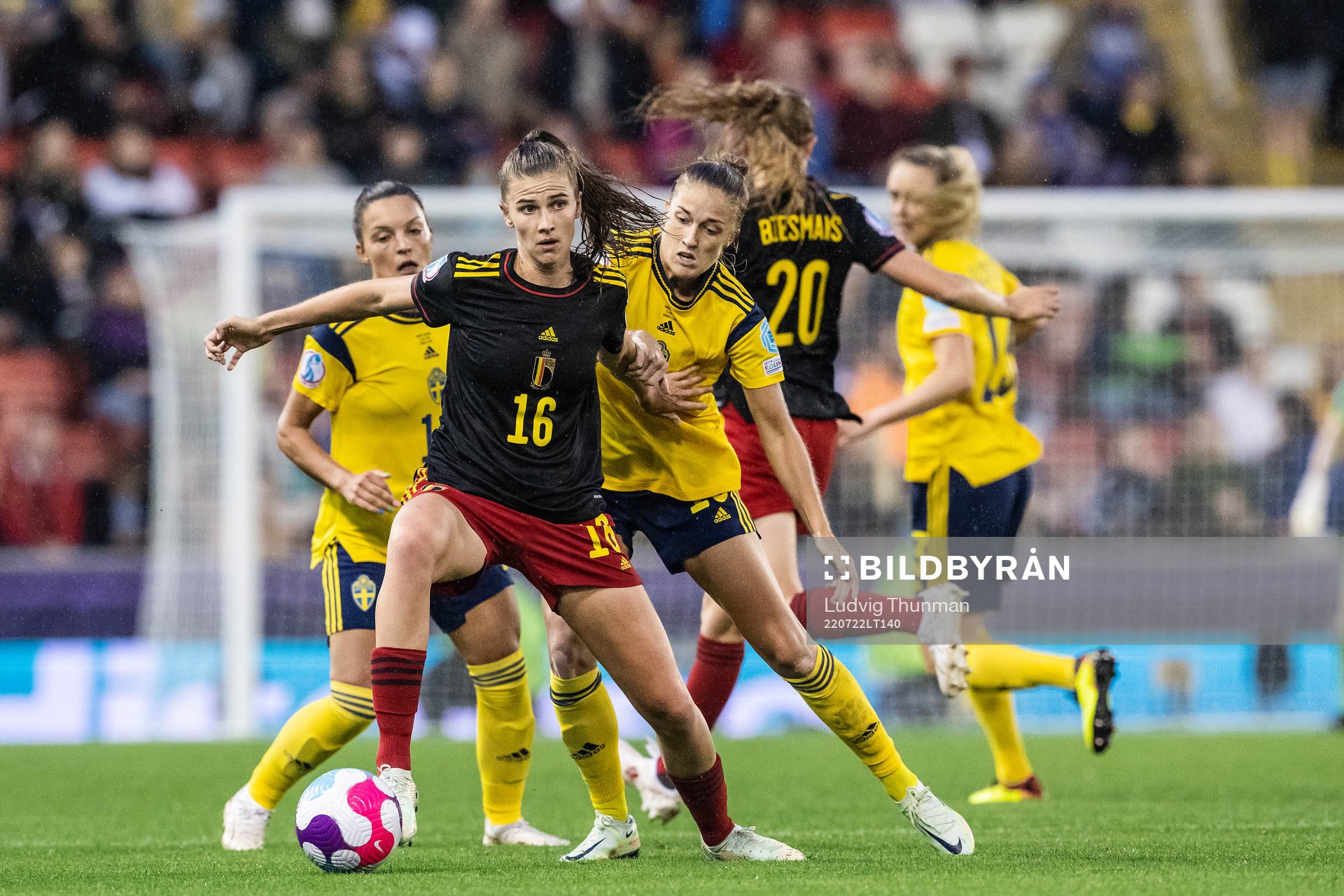 Marie Minnaert of Belgium against Johanna Rytting Kaneryd and Filippa Angeldahl of Sweden during the UEFA Women's Euro 2022 quarter final match between between Sweden and Belgium on July 22, 2022 in Leigh.