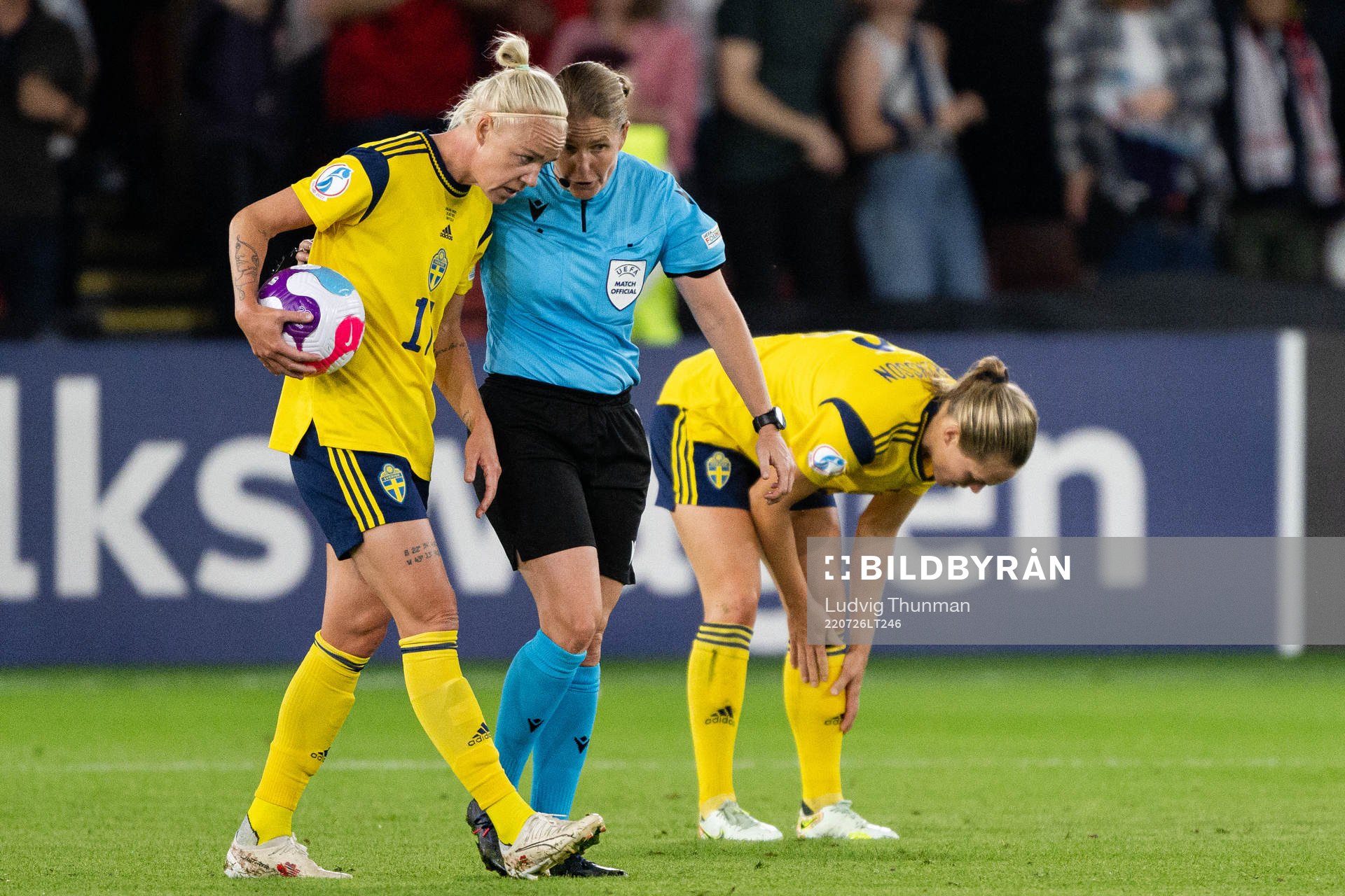 Caroline Seger of Sweden and referee Esther Staubli
