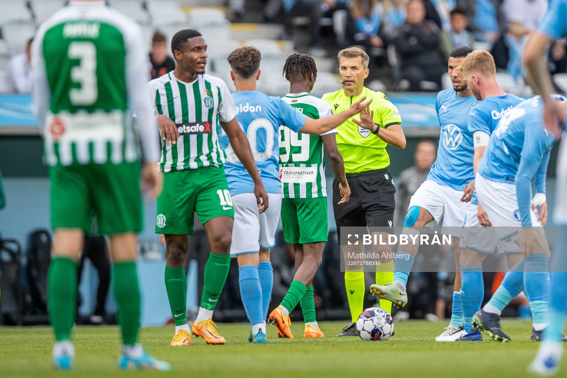 Referee Kristo Tohver and Kehinde Mathias Oyewusi of