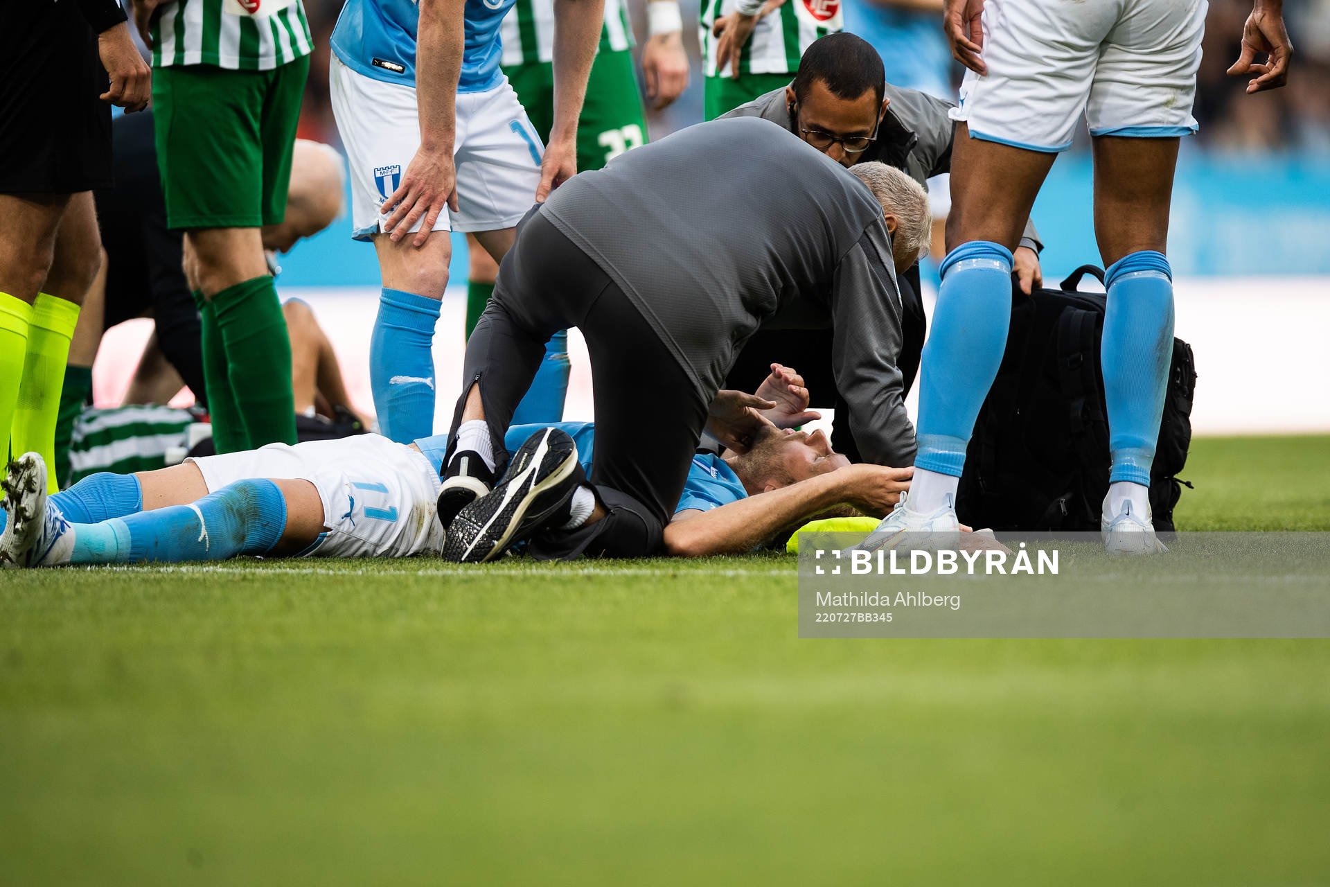 Ola Toivonen of Malmö FF receives medical attention