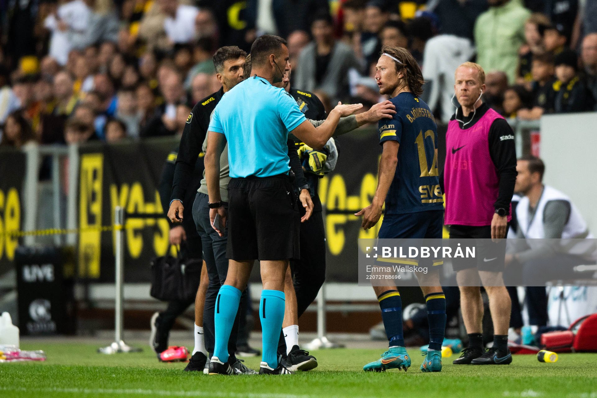 Referee Milos Milanović and Axel Björnström of AIK