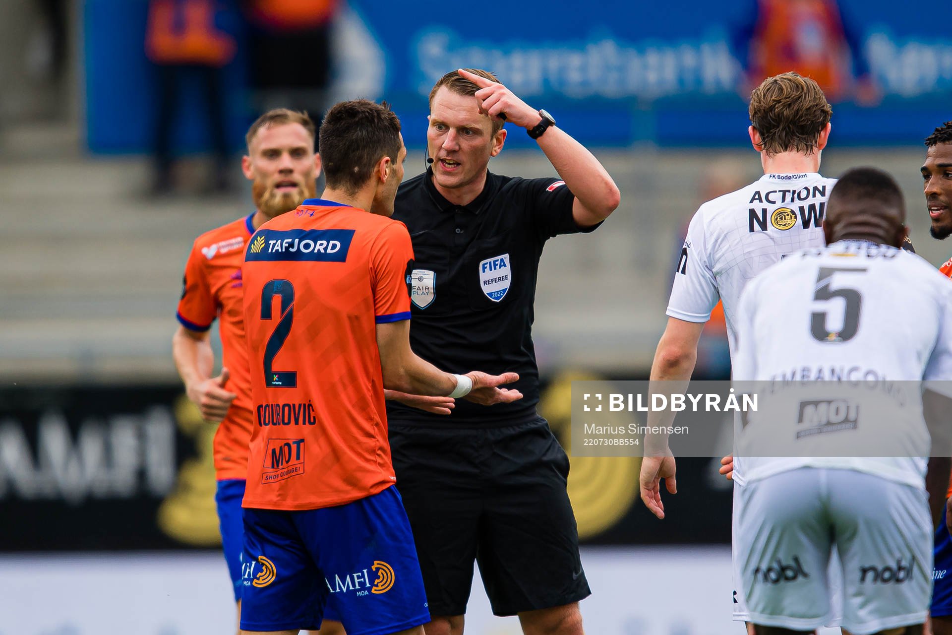 Petar Golubovic of Aalesund and Kai Erik Steen, referee