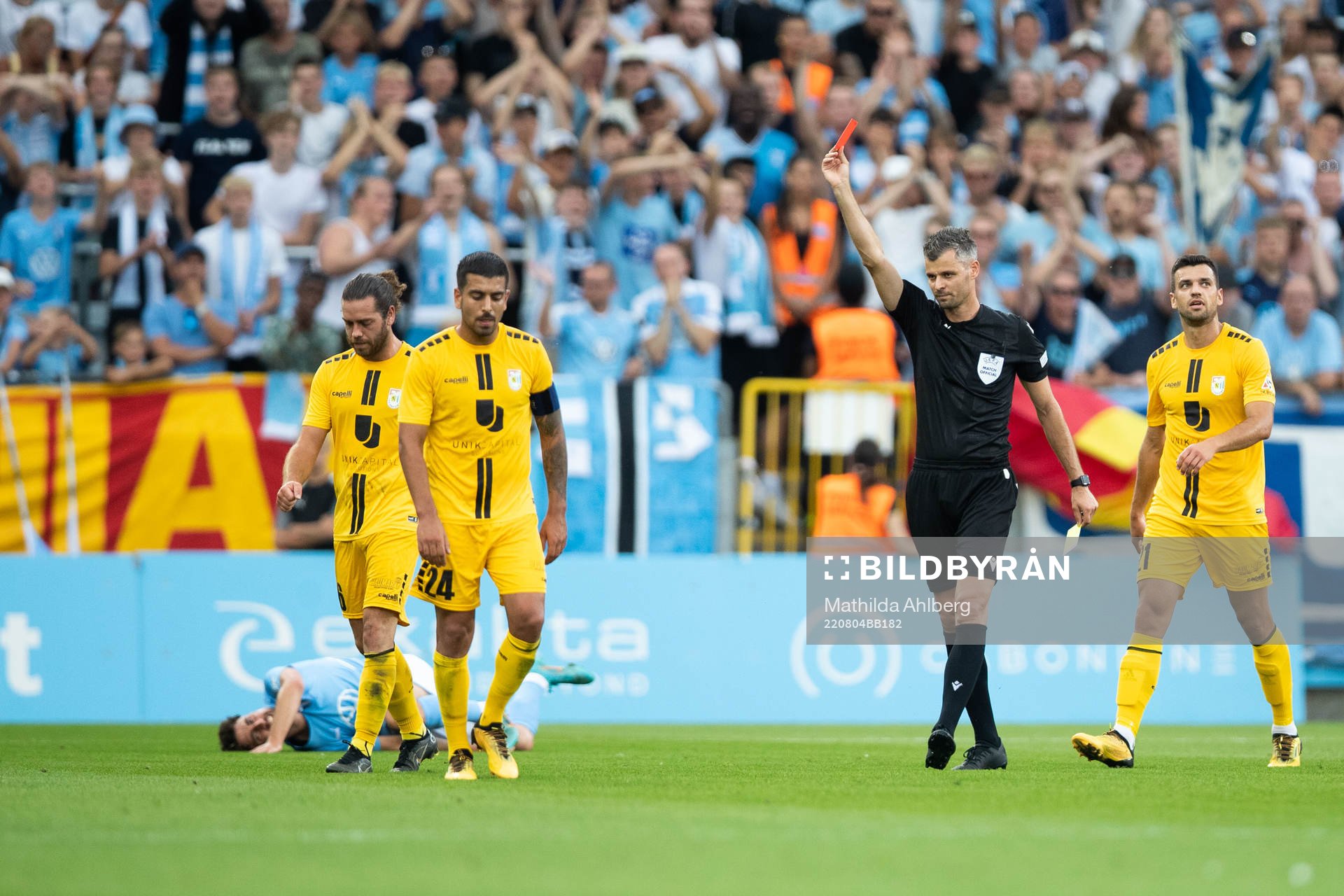 Charles Morren of Diddeleng receives a red card from referee Enea Jorgji during the UEFA Europa League qualification match between Malmö FF and Diddeleng on August 4, 2022 in Malmö.