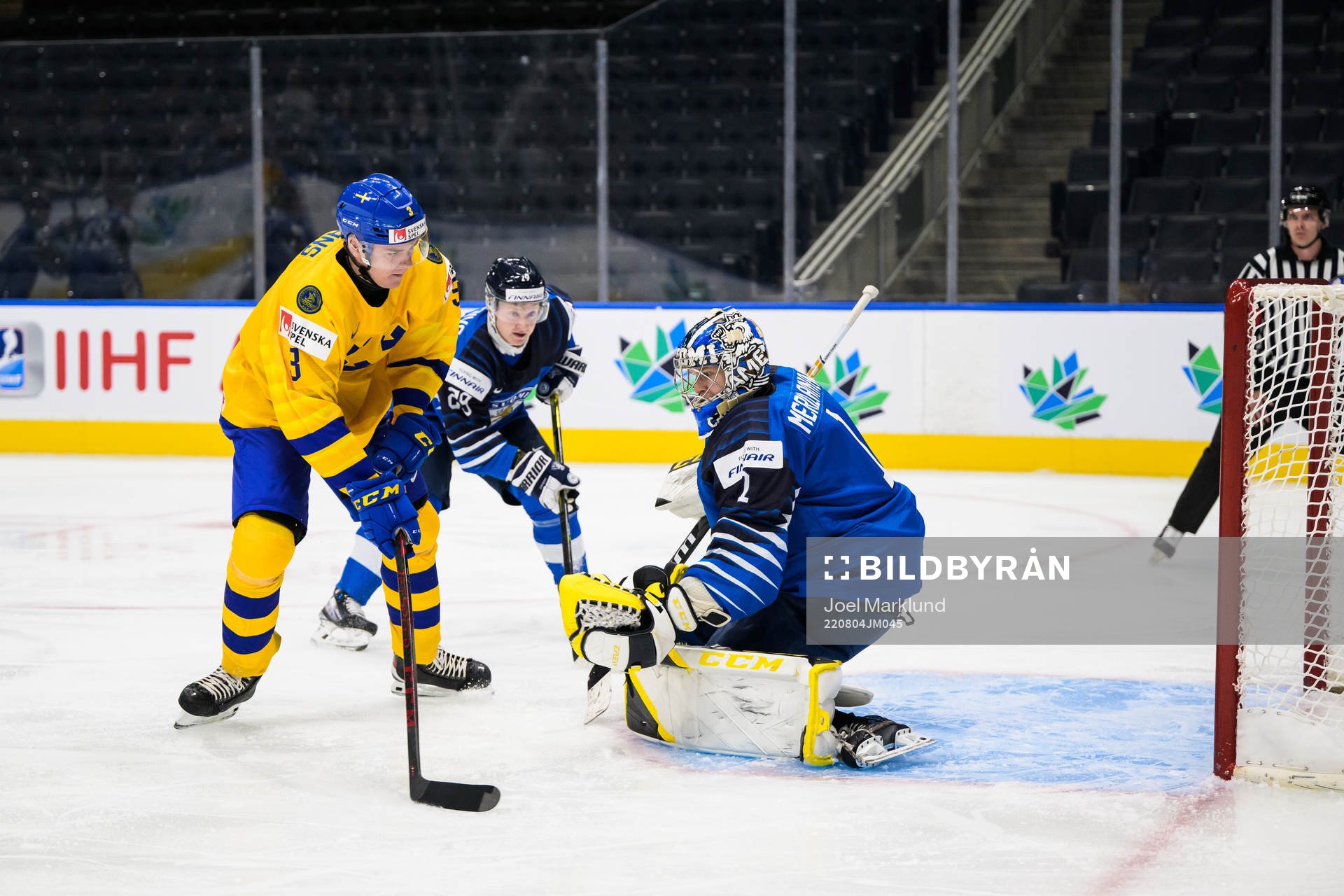 Helge Grans of Sweden scores 0-1 behind goaltender Leevi