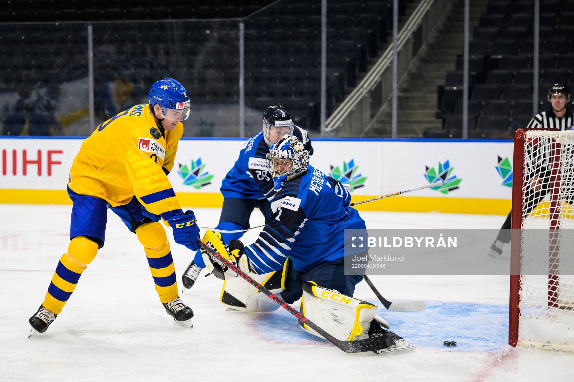 Helge Grans of Sweden scores 0-1 behind goaltender Leevi