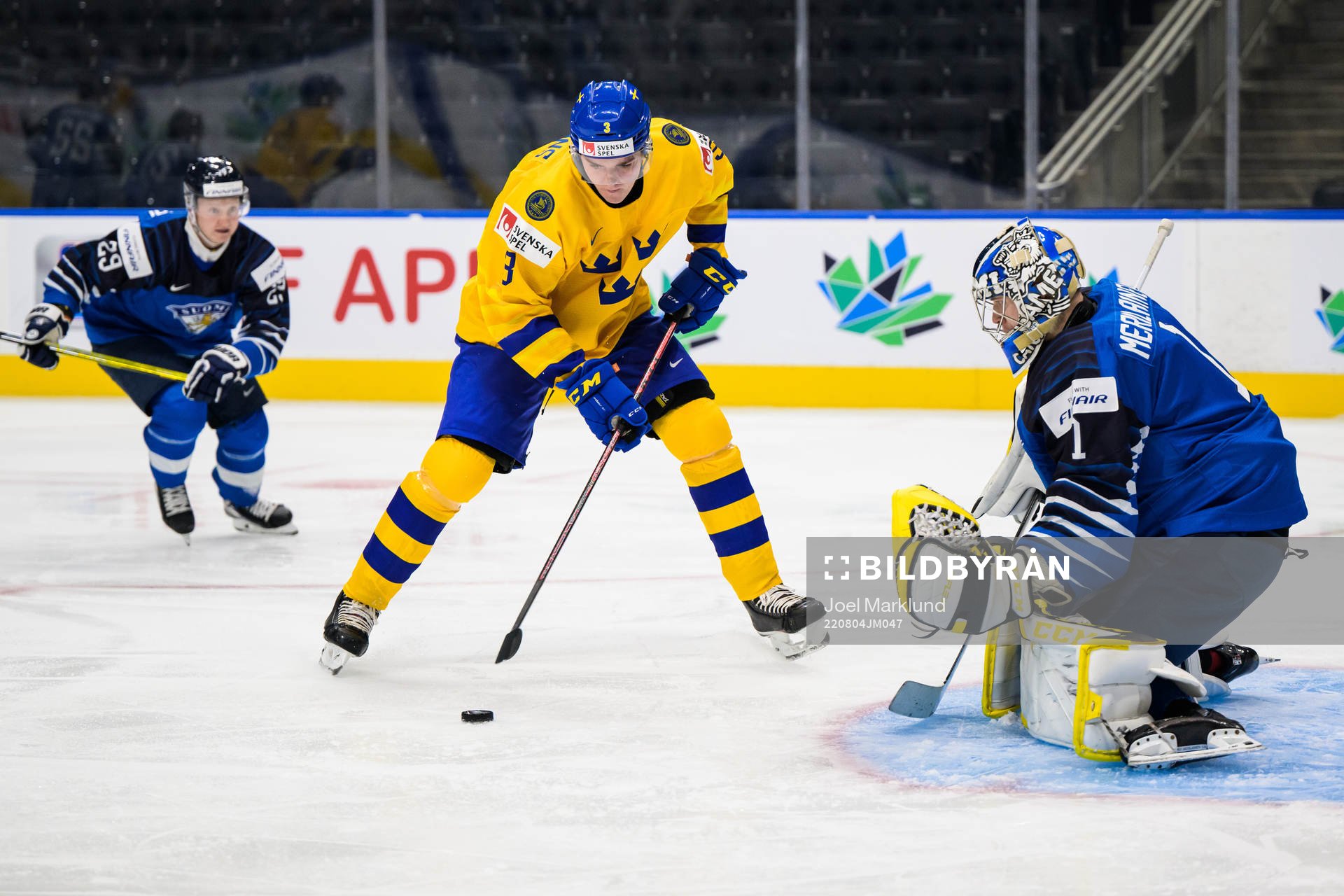 Helge Grans of Sweden scores 0-1 behind goaltender Leevi