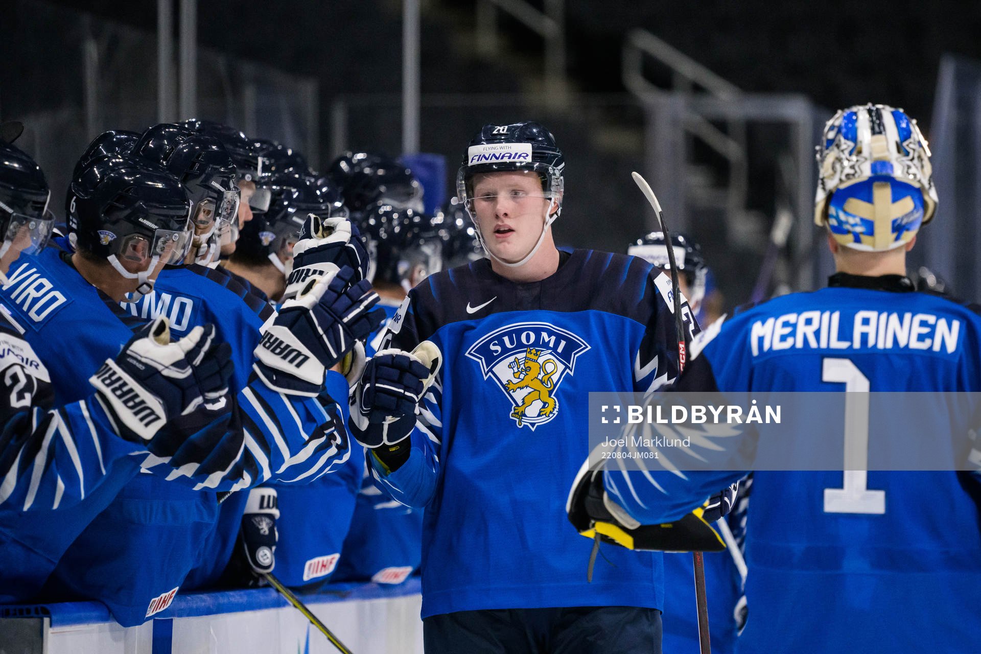 Samuel Helenius of Finland celebrates with teammates