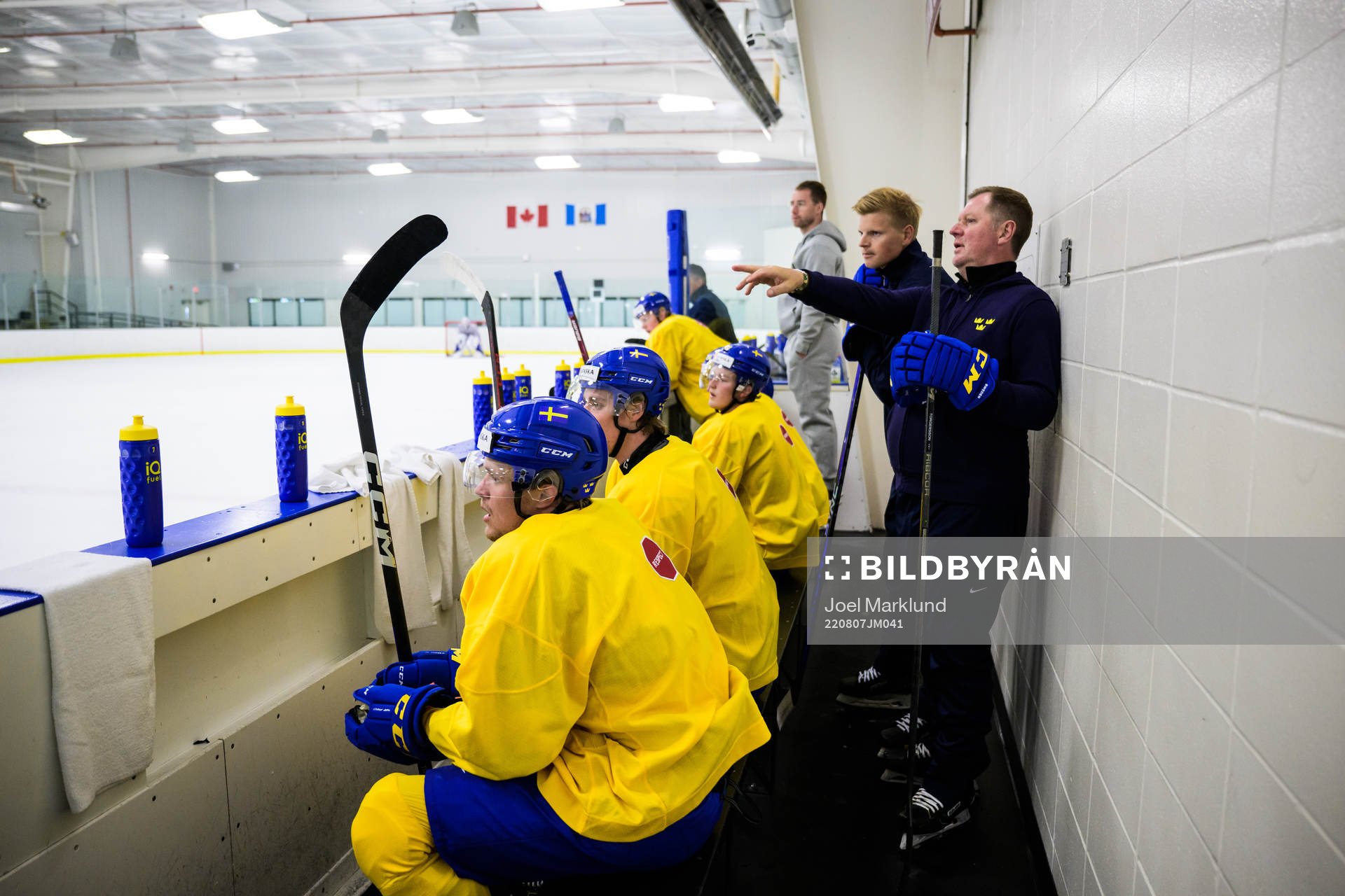 Assistant coach Patrik Andersson and goaltender coach Peter