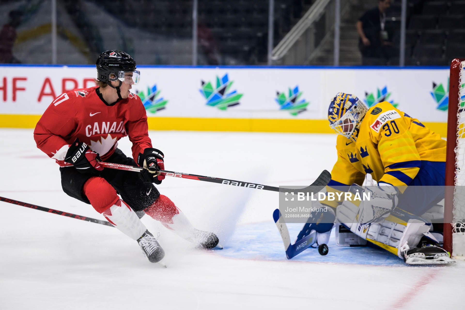 Ridly Greig of Canada and goaltender Calle Clang of Sweden