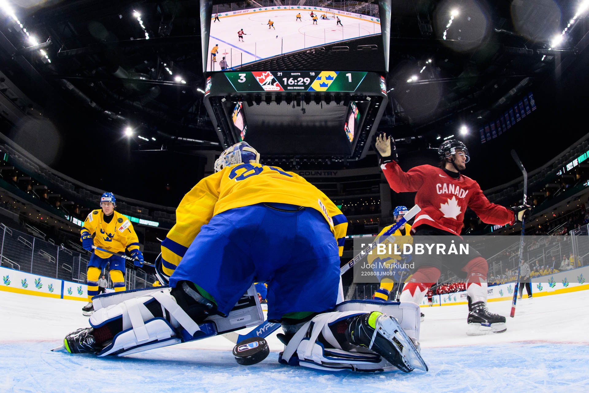 Joshua Roy of Canada celebrates as he scores 4-1 behind