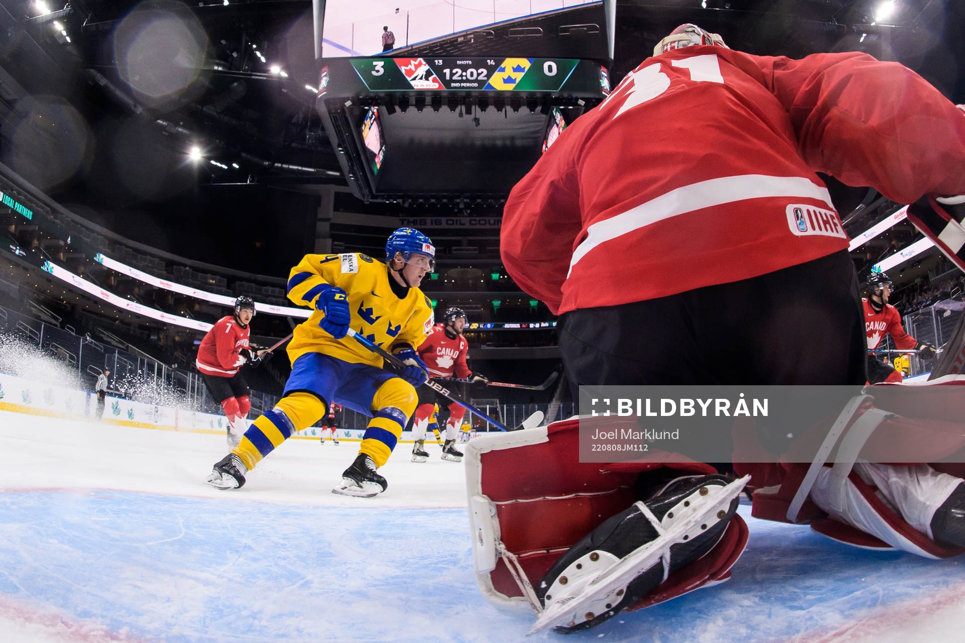 Emil Andrae of Sweden in front of goaltender Dylan Garand