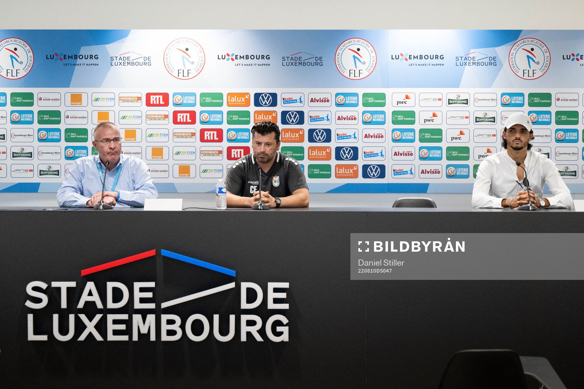 A translator, head coach Carlos Fanguerio and Aldin Skenderovic of Diddeleng during a press meeting on August 10, 2022 in Luxembourg.