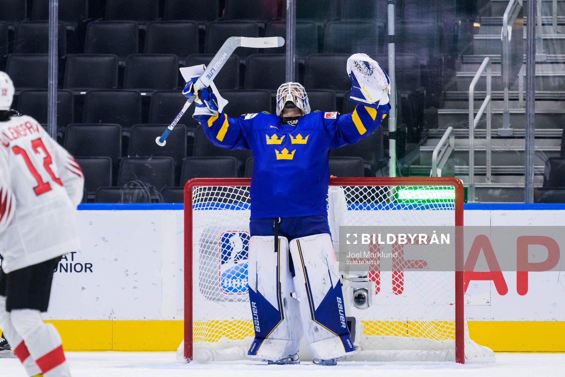 goaltender Jesper Wallstedt of Sweden celebrates