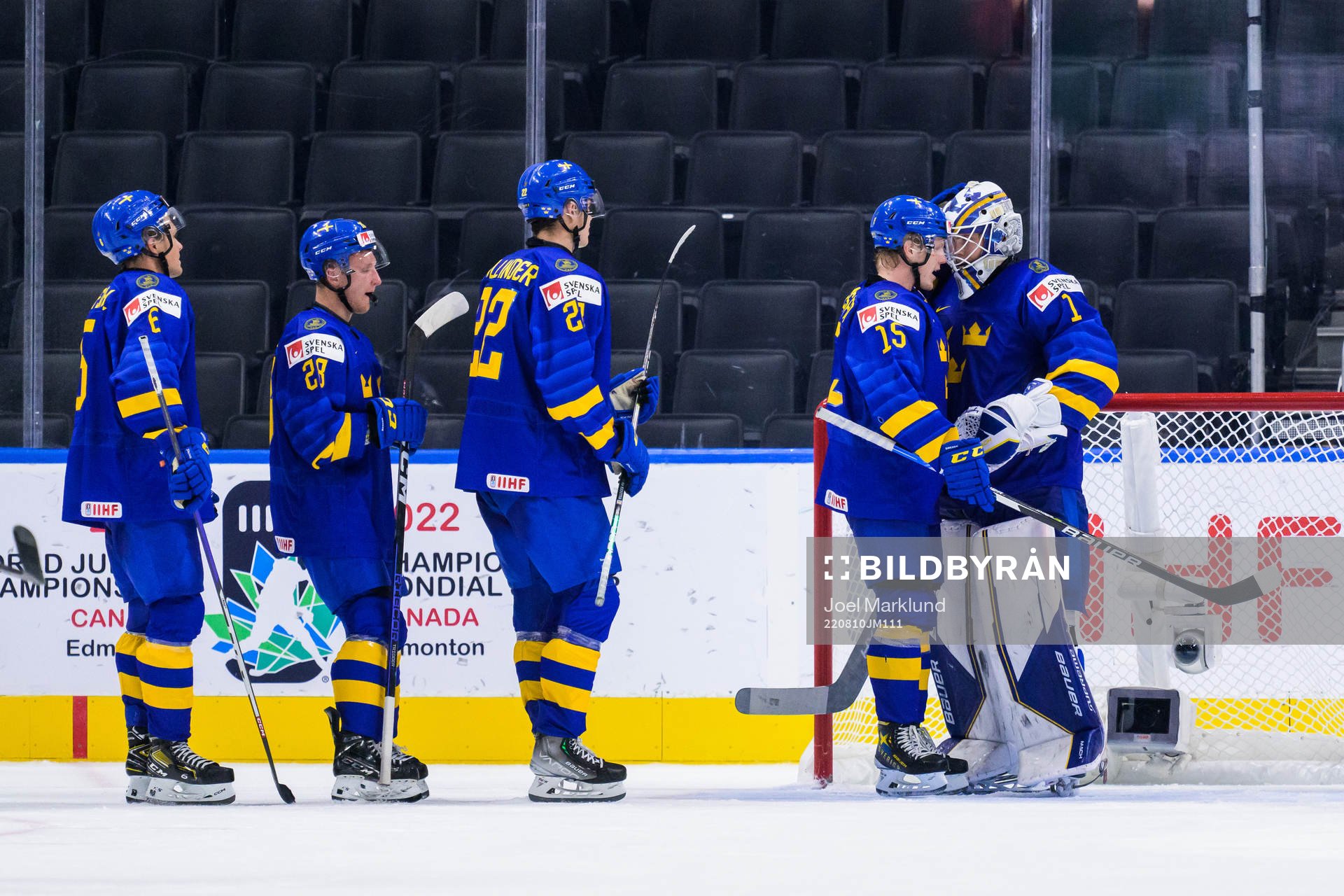 Åke Stakkestad and goaltender Jesper Wallstedt of Sweden
