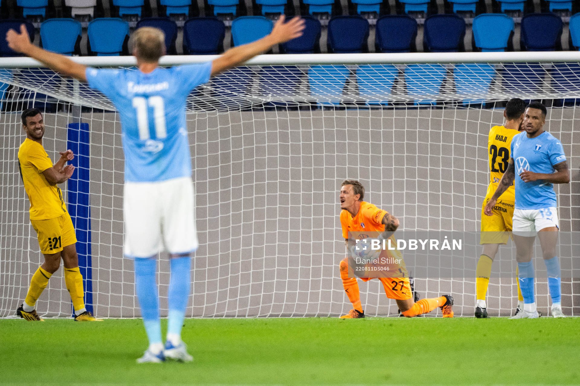 Goalkeeper Johan Dahlin and Martin Olsson of Malmö FF look