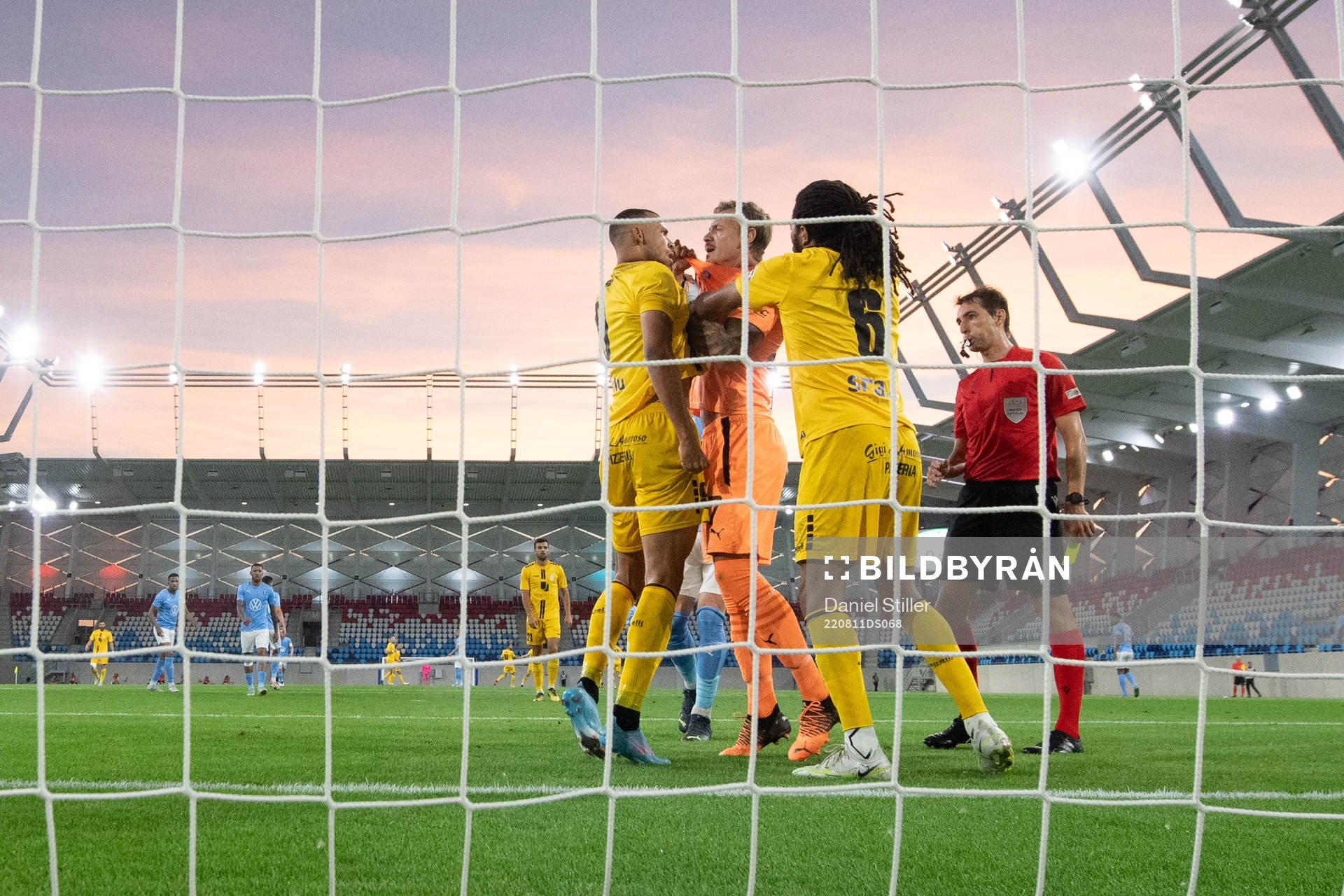 Goalkeeper Johan Dahlin of Malmö FF argues with Magno De Souza Machado Joao Victo and Melito Cruz of Diddeleng during the UEFA Europa League qualification between Diddeleng and Malmö FF on August 11, 2022 in Luxembourg.