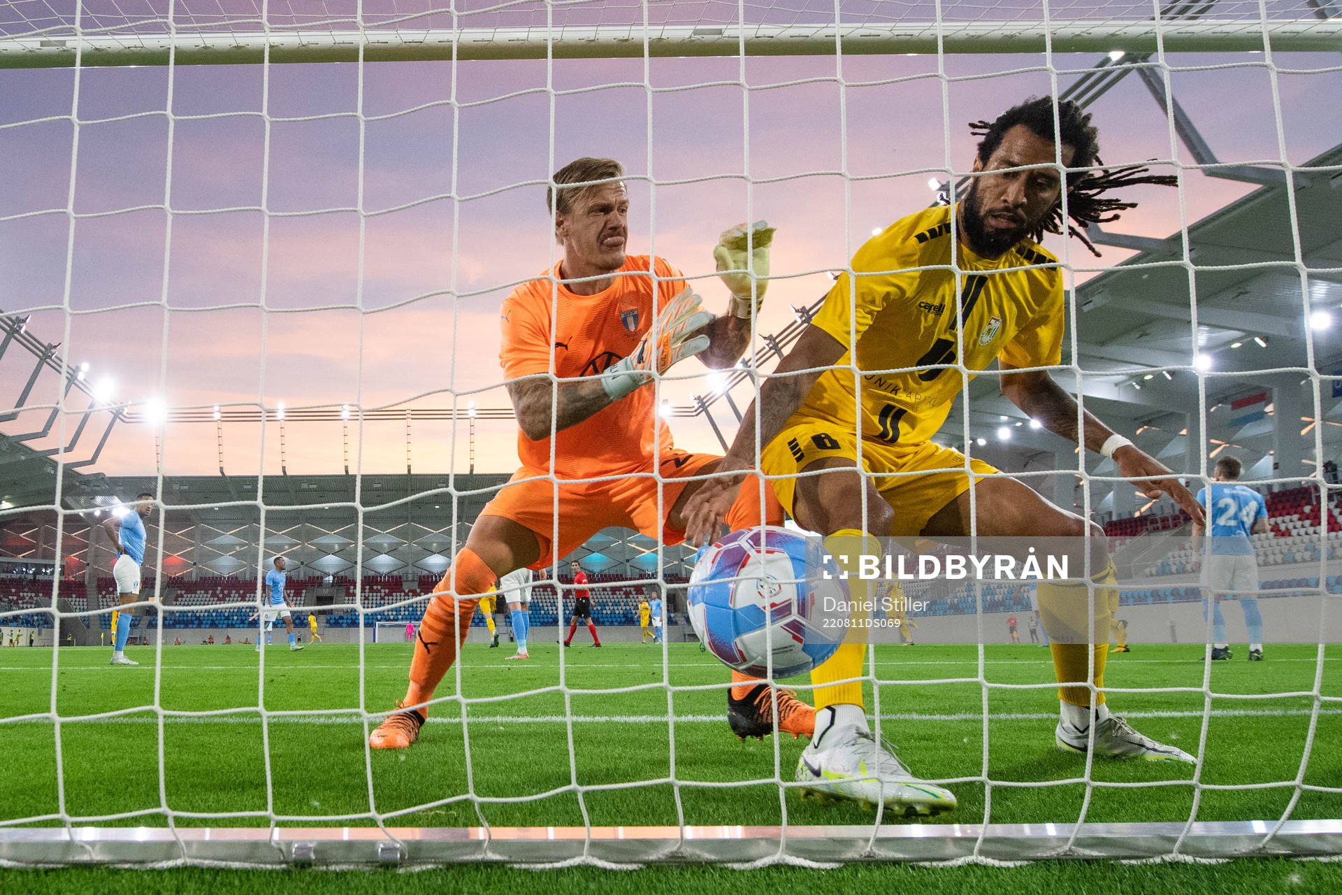 Goalkeeper Johan Dahlin of Malmö FF and Melito Cruz of Diddeleng during the UEFA Europa League qualification between Diddeleng and Malmö FF on August 11, 2022 in Luxembourg. 