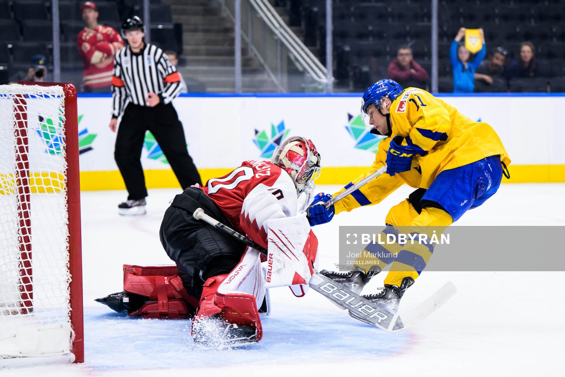 Goaltender Sebastian Wraneschitz of Austria saves a penalty