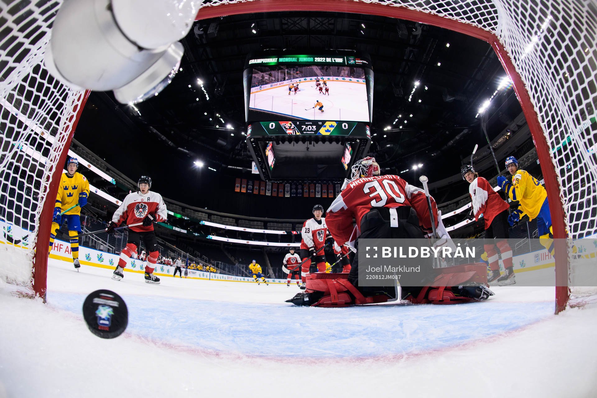 Goaltender Sebastian Wraneschitz of Austria lets in the 0-1