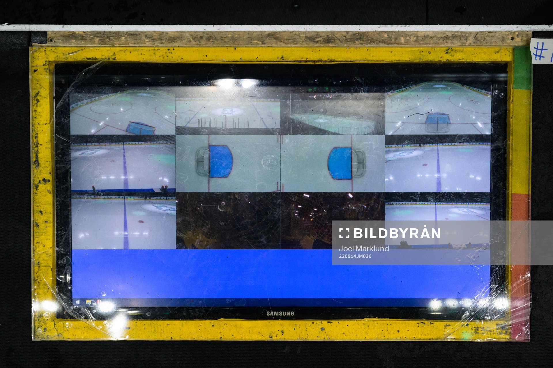 A screen showing multiple camera angles at the coaches