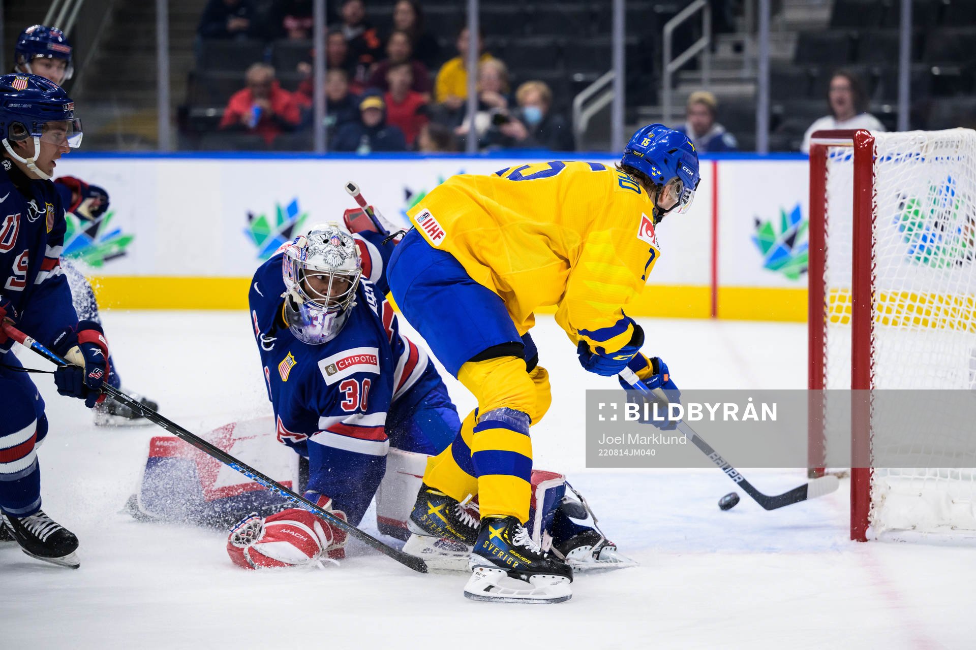 Goaltender Kaidan Mbereko of USA is being challenged by