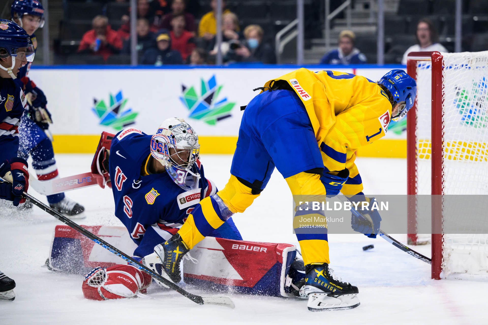 Goaltender Kaidan Mbereko of USA is being challenged by