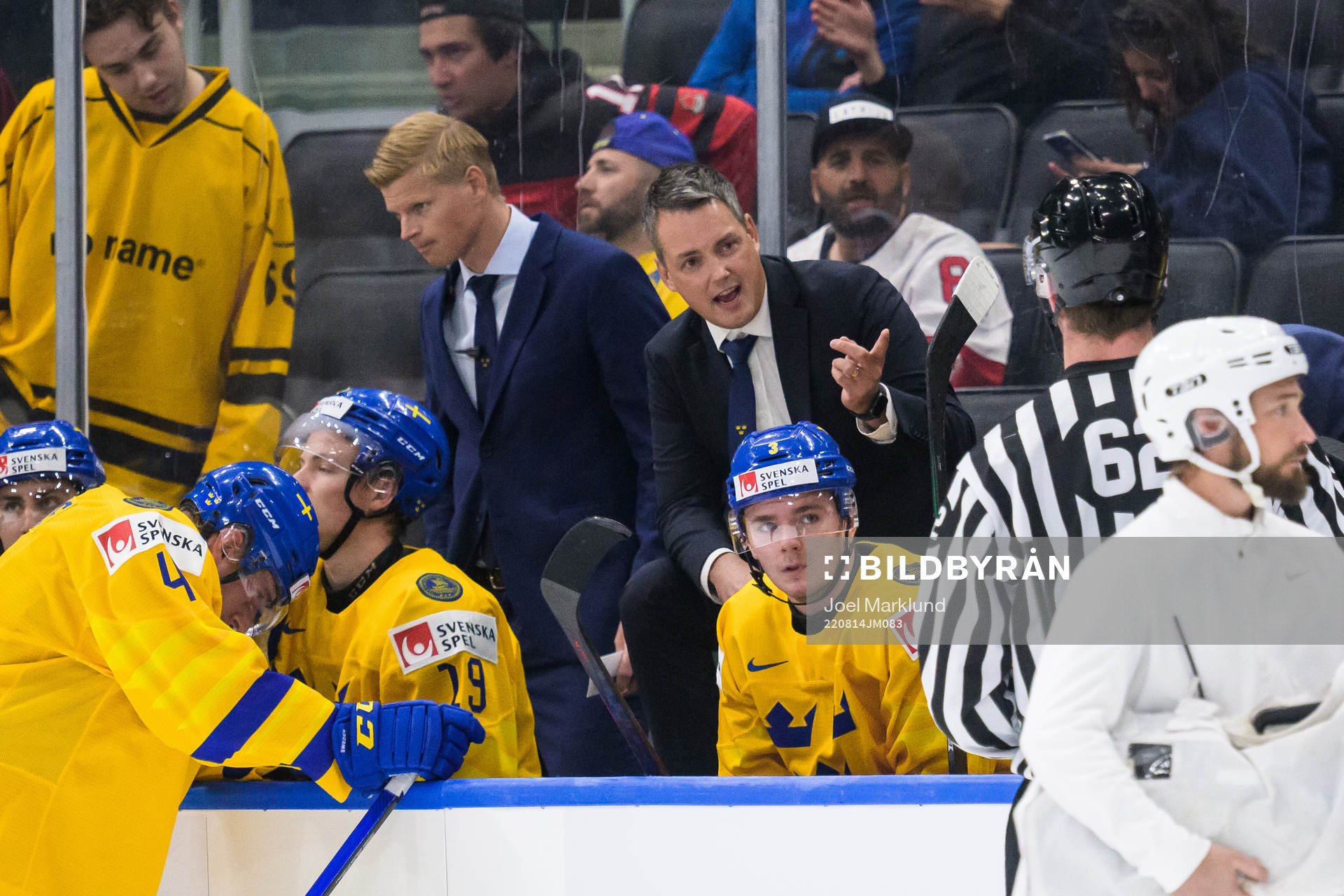 Head coach Tomas Montén of Sweden talks to a linesman