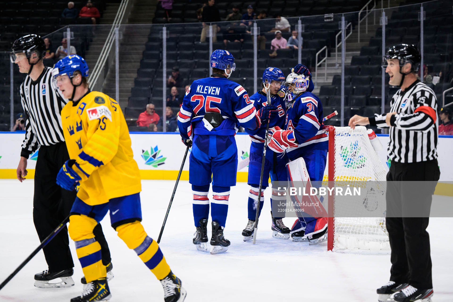 Tyler Kleven, Brock Faber and goaltender Kaidan Mbereko of