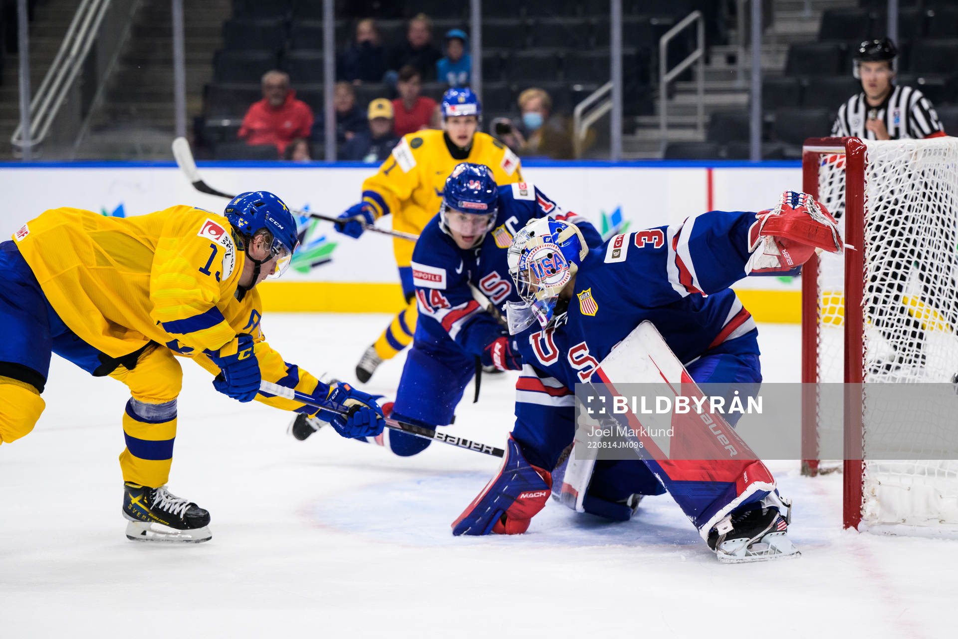 Åke Stakkestad of Sweden scores 3-2 behind goaltender