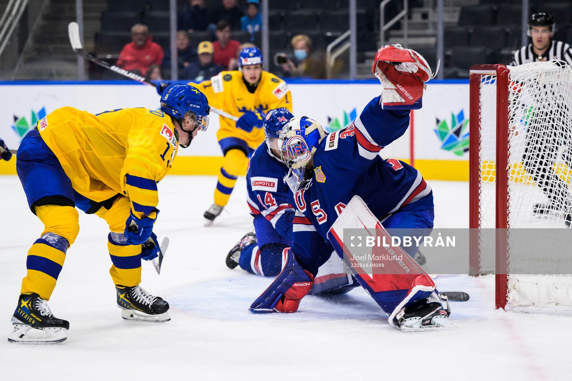 Åke Stakkestad of Sweden scores 3-2 behind goaltender