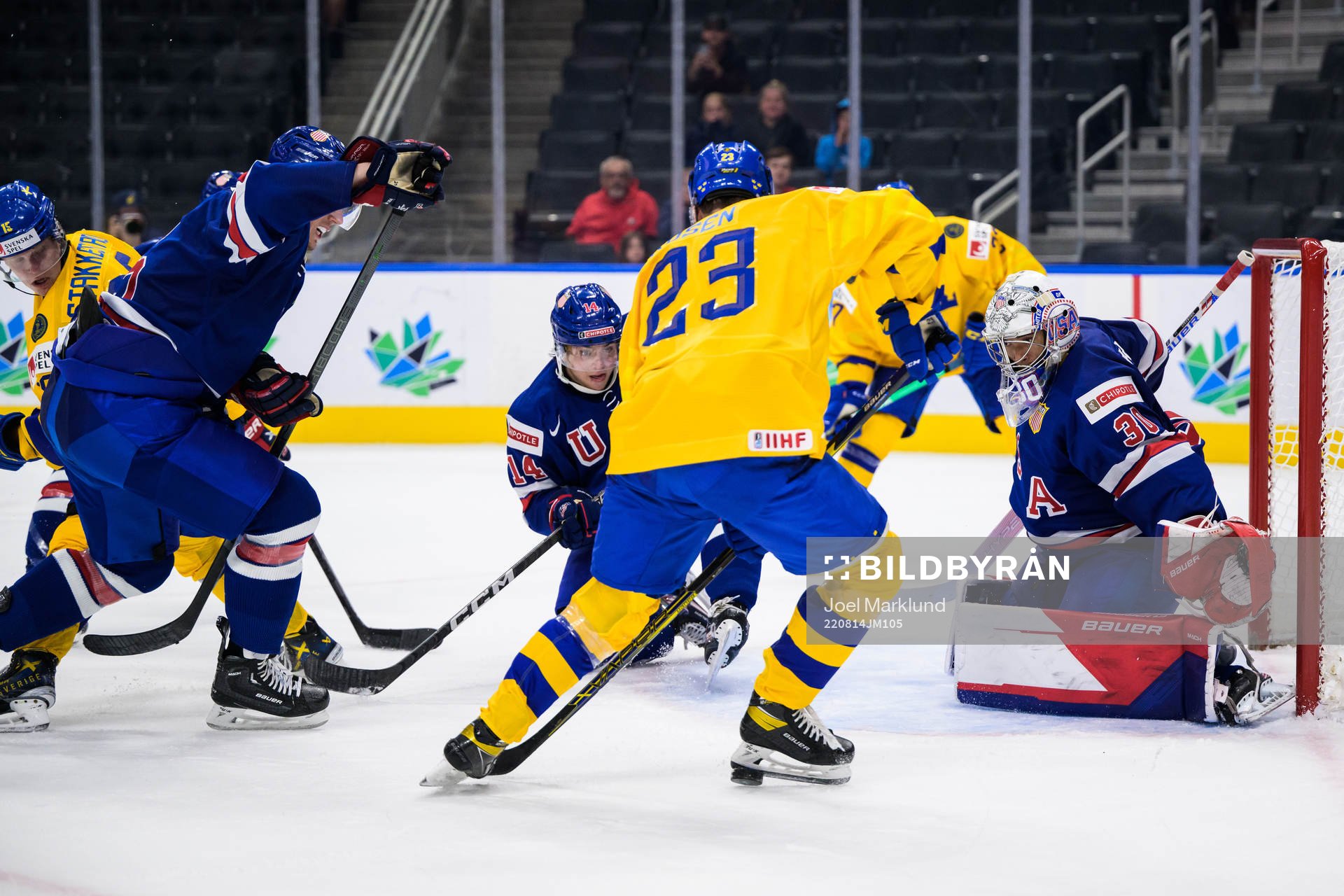 Brock Faber and goaltender Kaidan Mbereko of USA are being