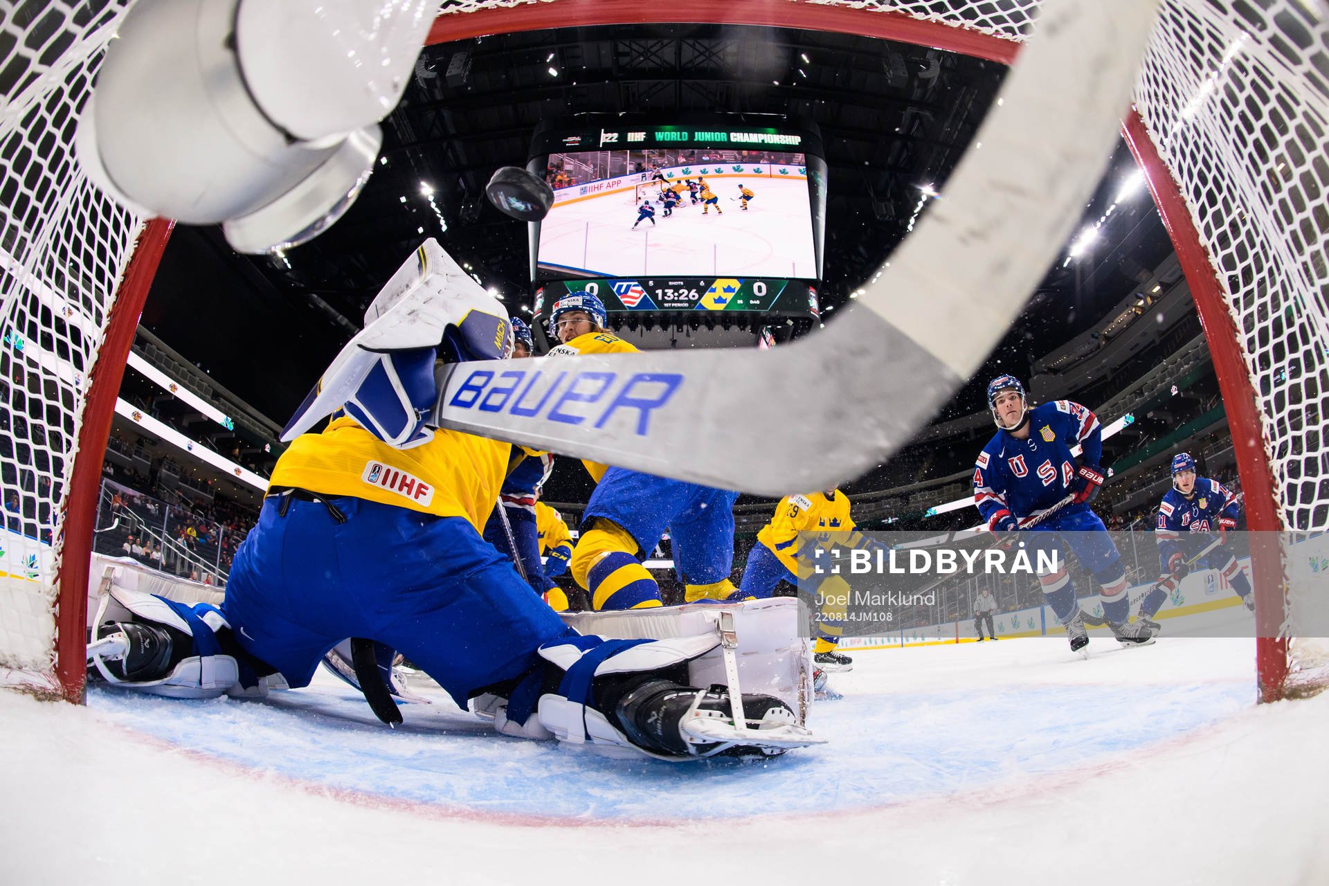 Brett Berard of USA scores 1-0 behind goaltender Jesper