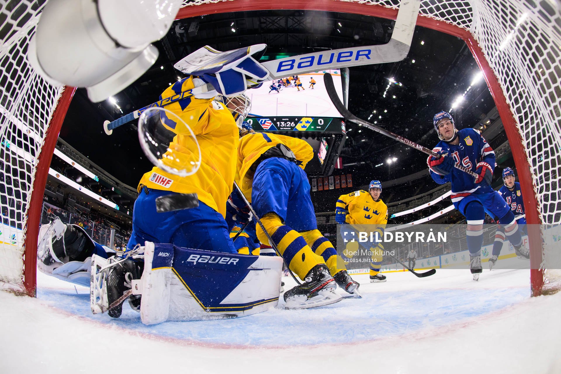 The glass of a broadcast net camera lets loose when Brett