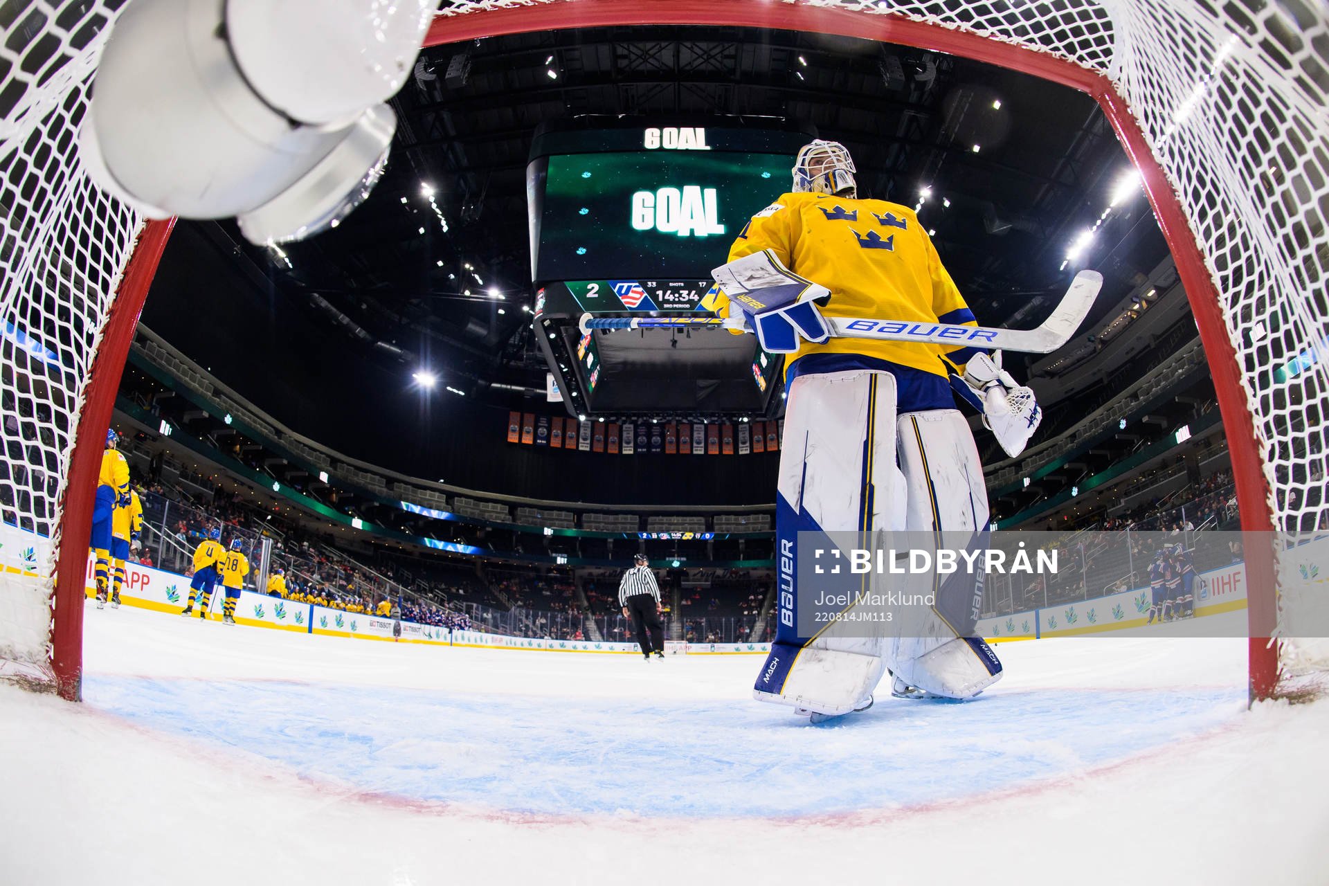 Goaltender Jesper Wallstedt of Sweden looks dejected
