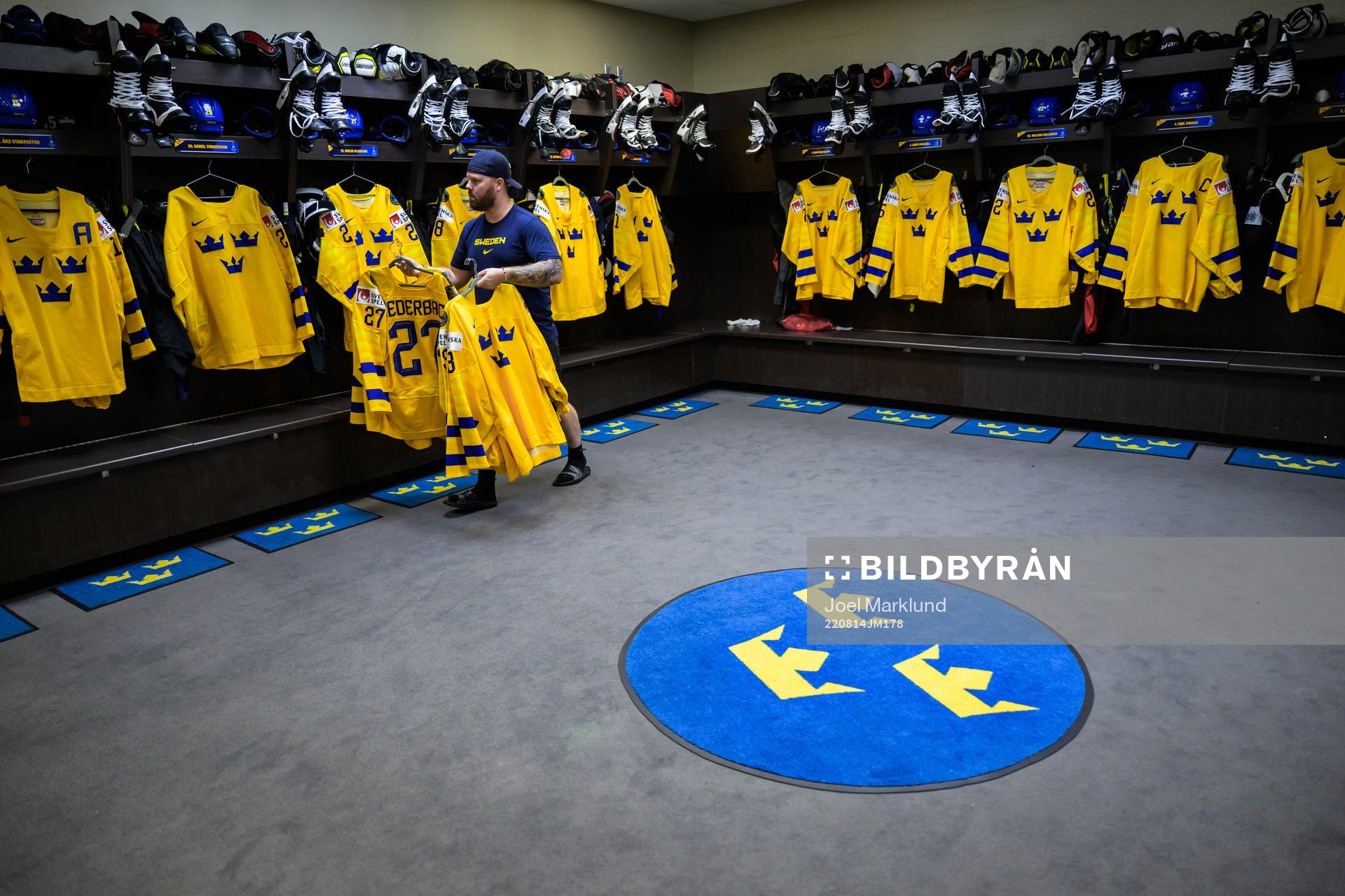 Equipment manager Andy Fagerström of Sweden hangs jerseys