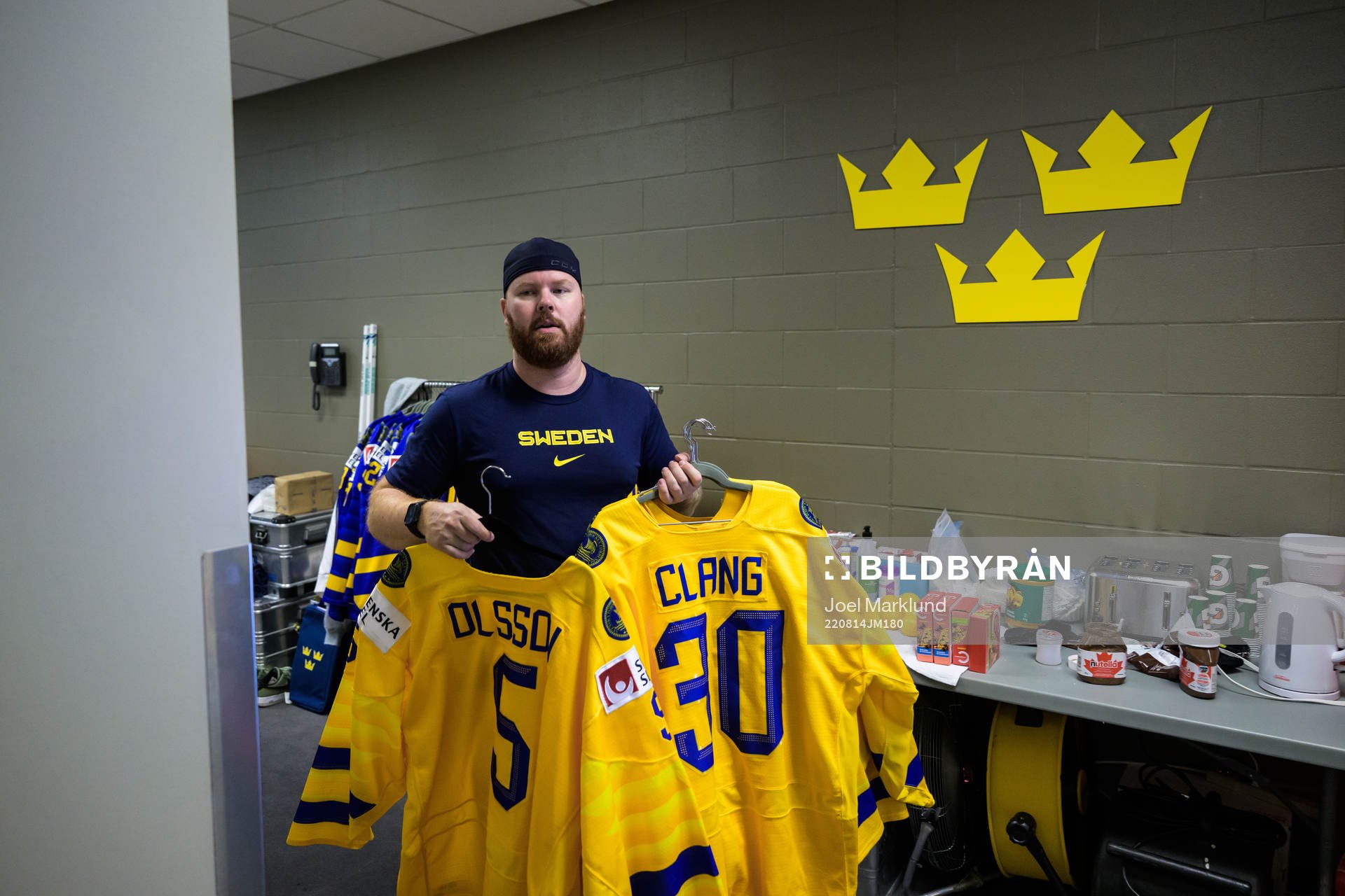 Equipment manager Andy Fagerström of Sweden hangs jerseys
