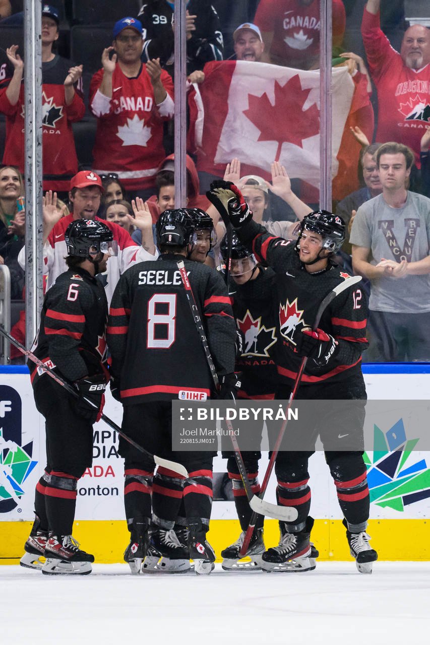 Tyson Foerster of Canada celebrates with teammates