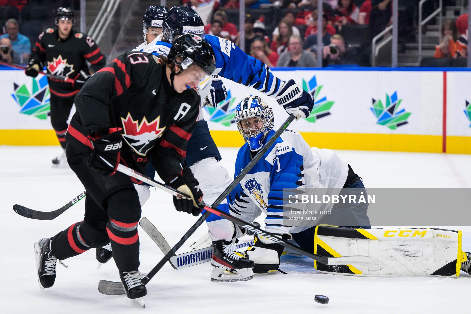 Kent Johnson of Canada in front of goaltender Leevi
