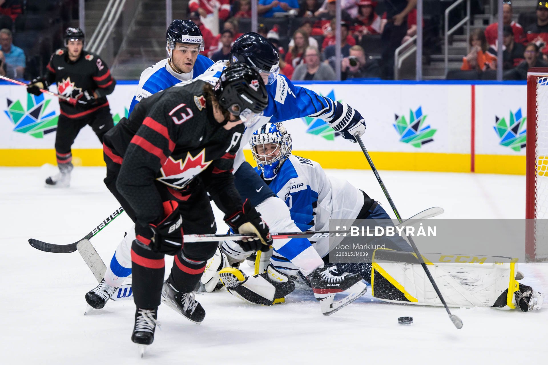 Kent Johnson of Canada in front of goaltender Leevi