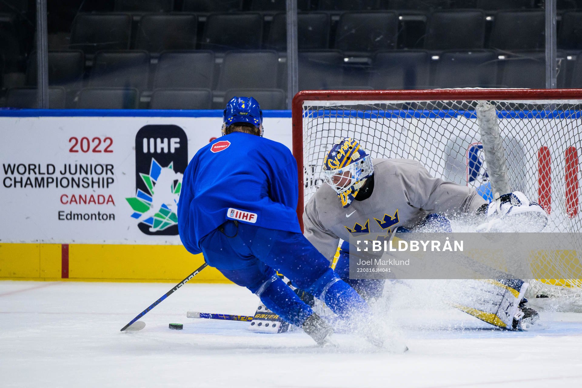 Emil Andrae and goaltender Calle Clang of Sweden at a