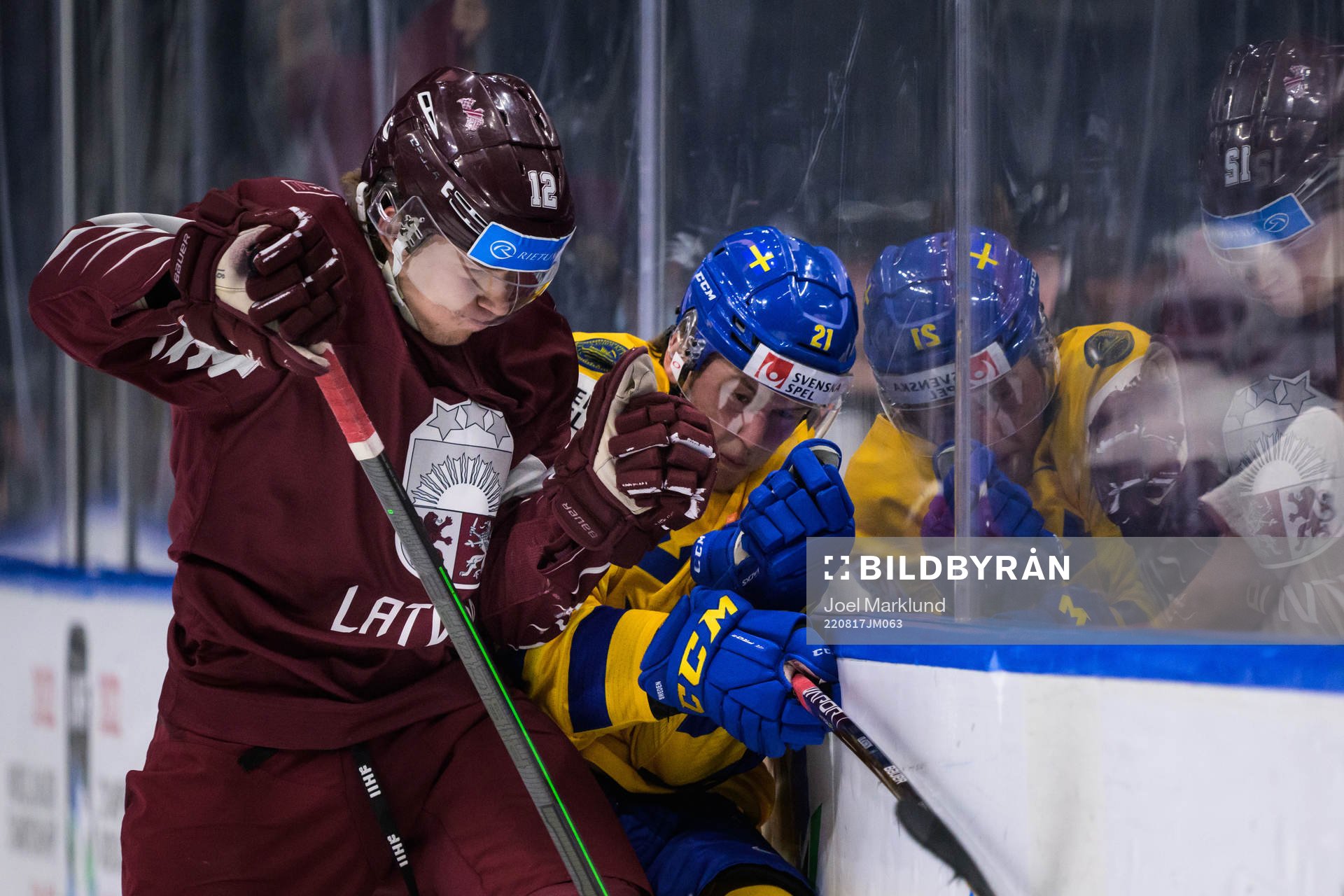 Harijs Brants of Latvia tackles Oskar Olausson of Sweden