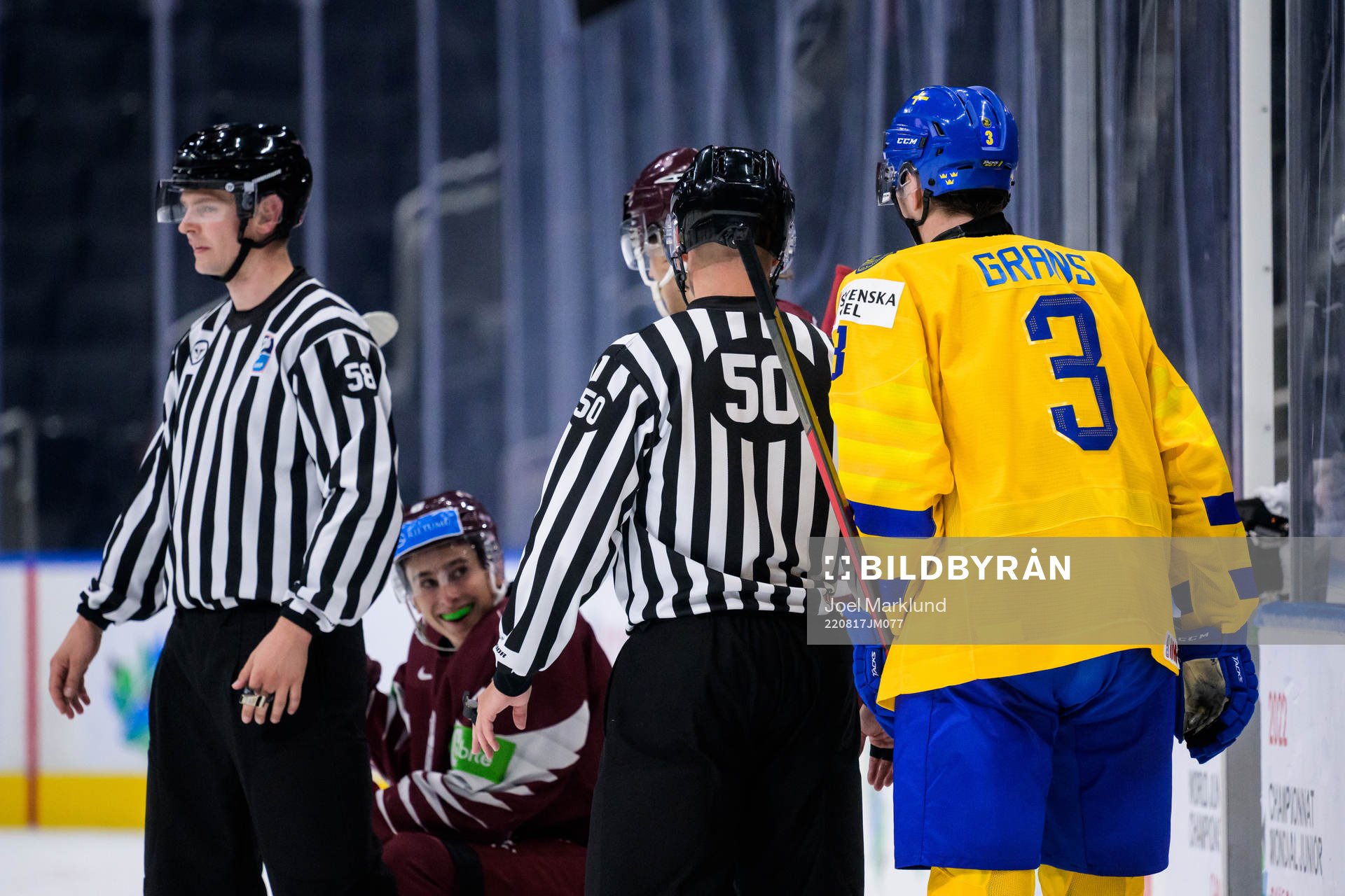 Martins Lavins of Latvia smiles at Helge Grans of Sweden
