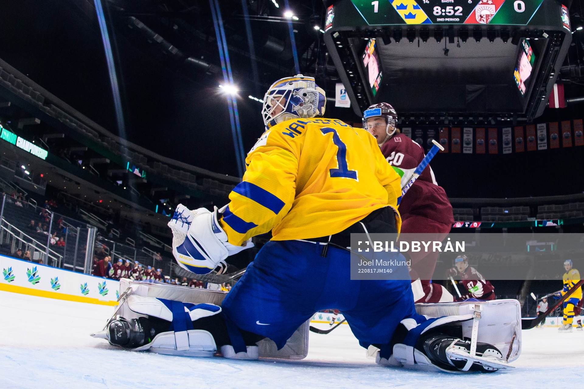 Goaltender Jesper Wallstedt of Sweden and Peteris Purmalis