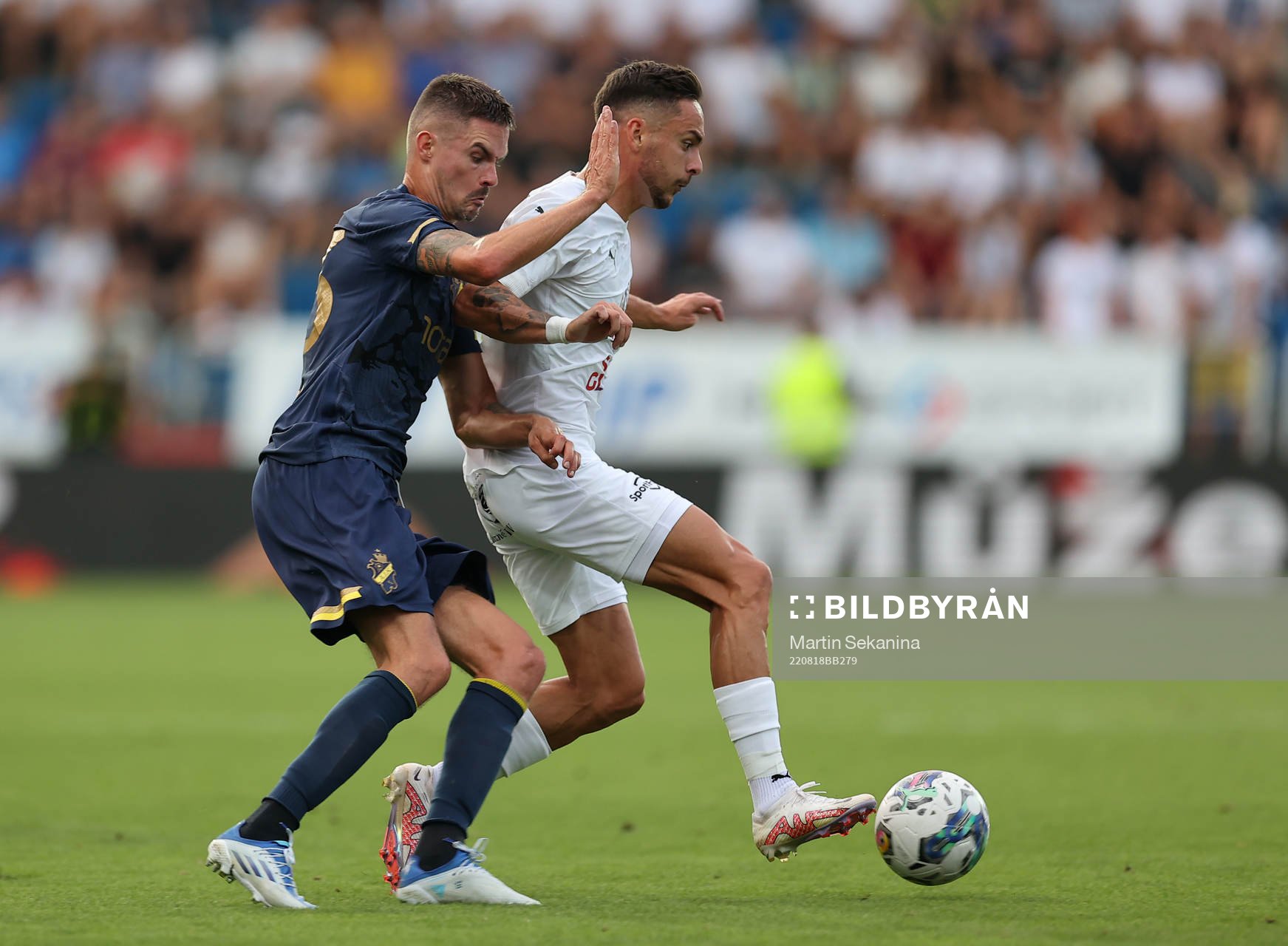 Mikael Lustig of AIK and Daniel Holzer of Slovacko