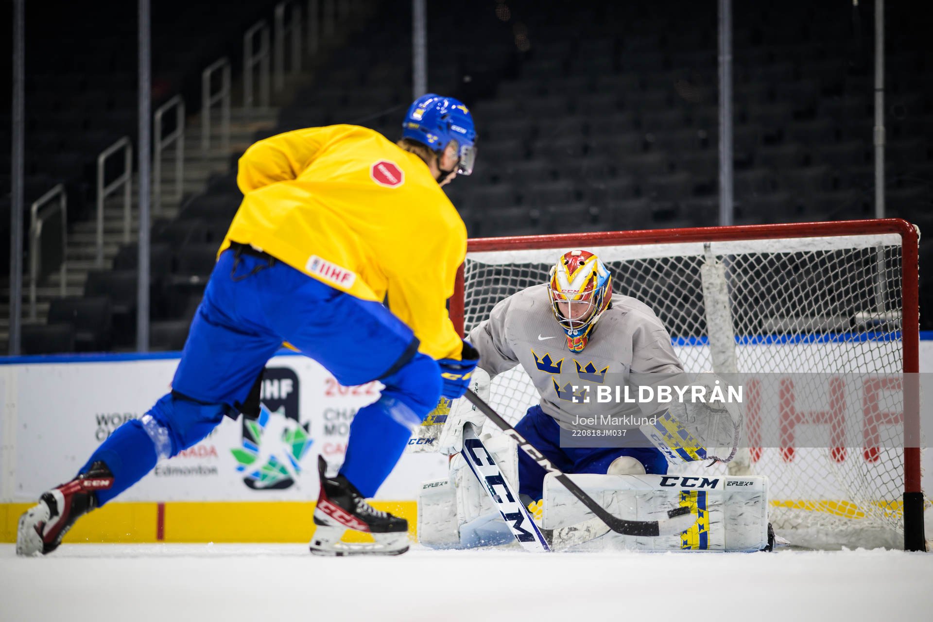Albert Sjöberg and goaltender Carl Lindbom of Sweden at a