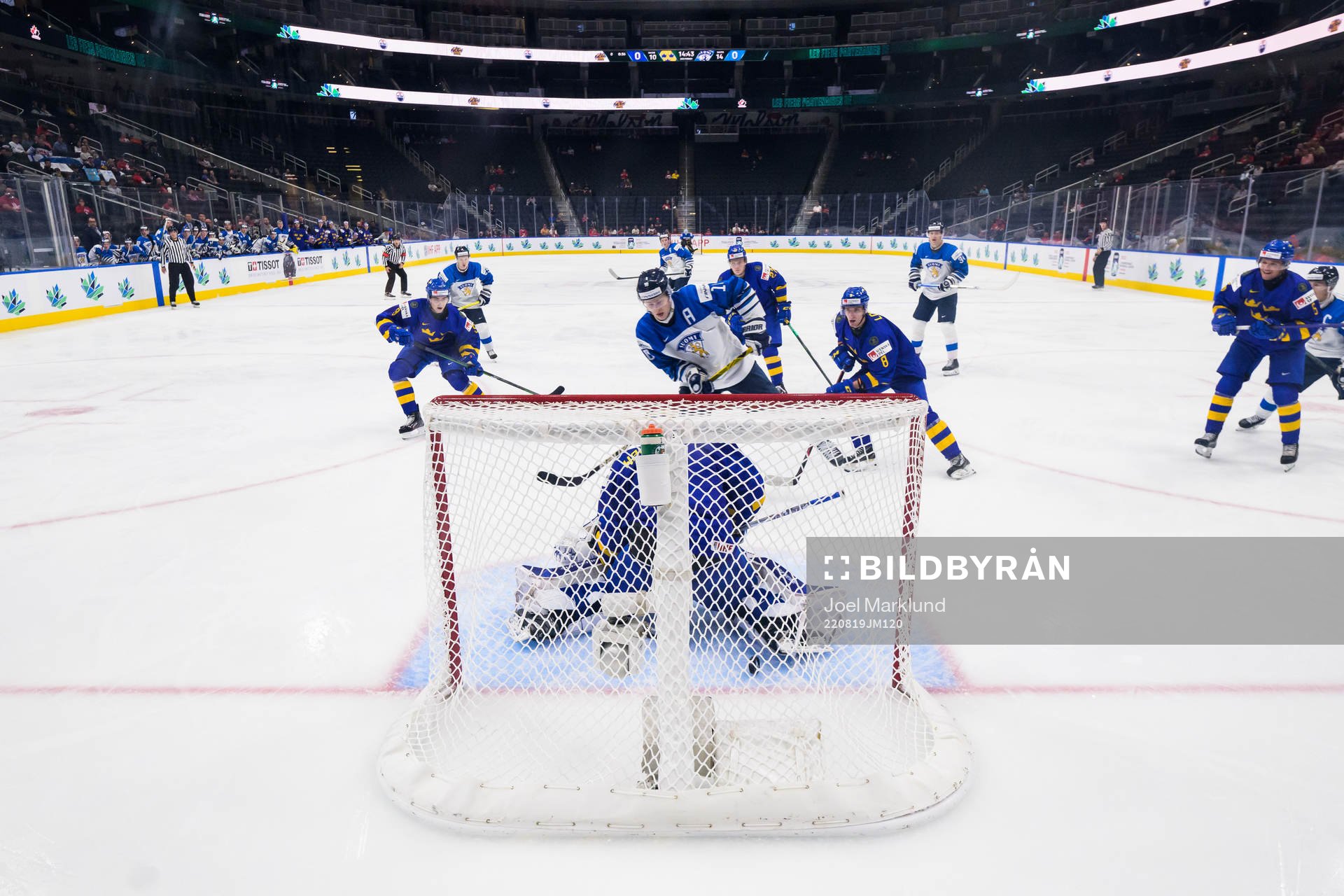 Kasper Puutio of Finland scores 0-1 behind goaltender