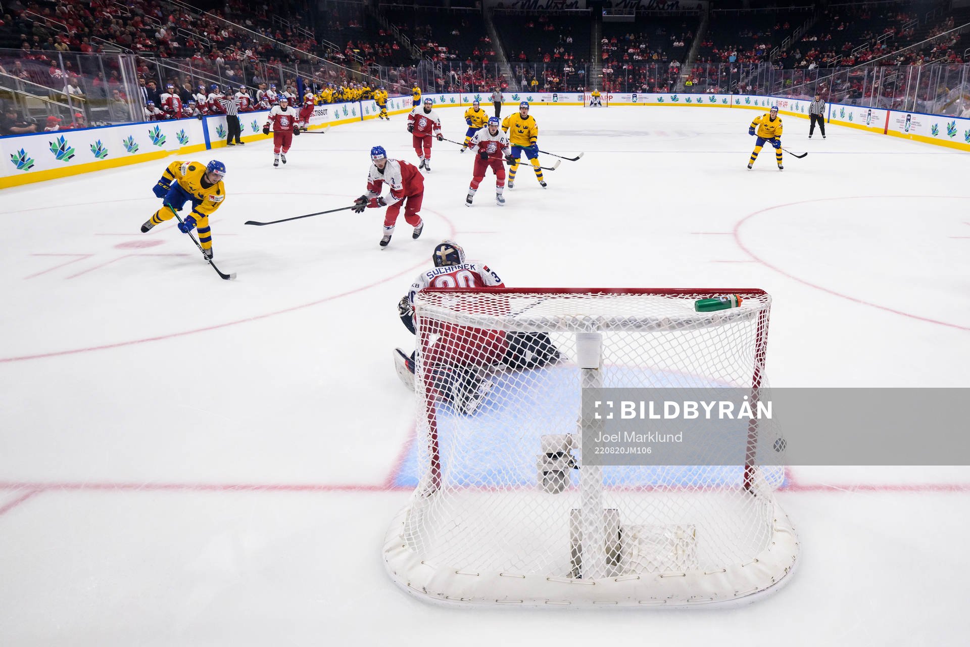 Linus Sjödin of Sweden scores 3-1 behind goaltender Tomas